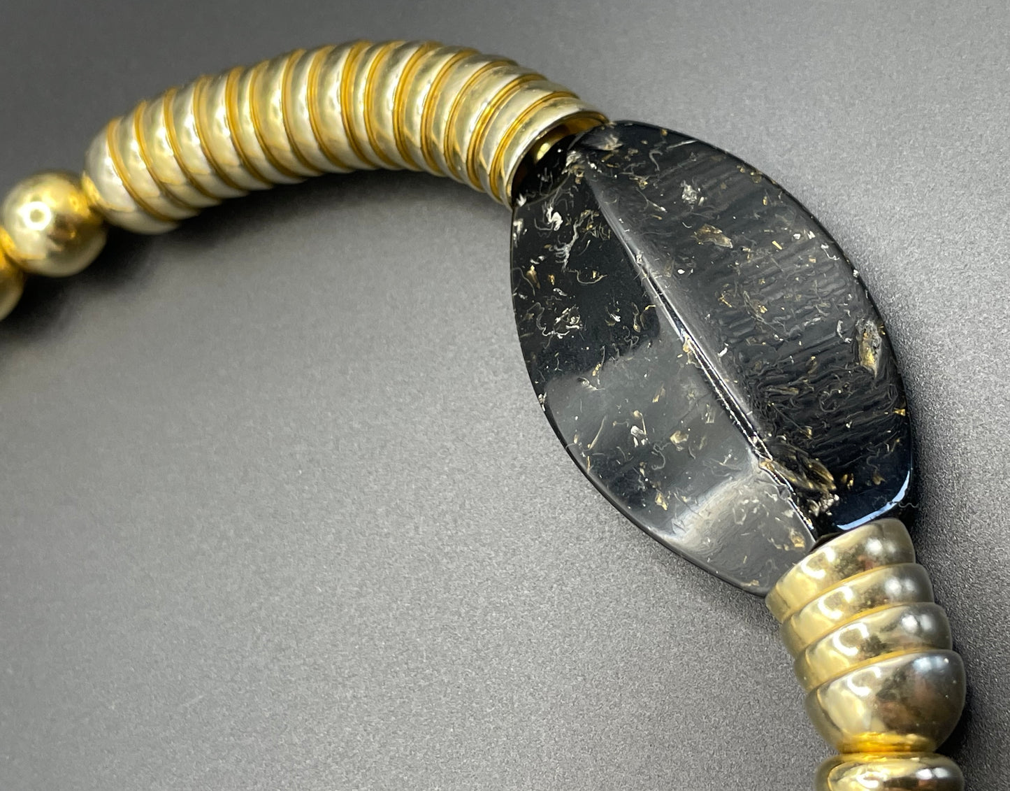 Vintage Jakob Bengel Art Deco 1930s machine age collar necklace with gold tone stacked cup beads and huge black, sparkly galalith beads