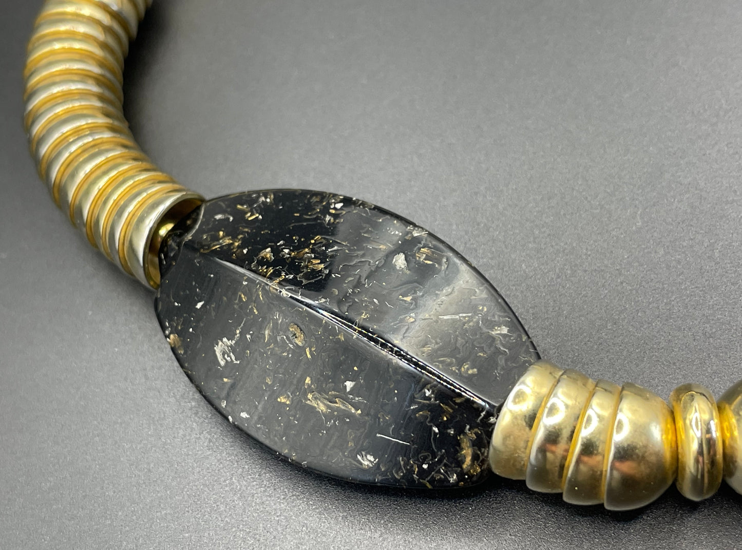 Vintage Jakob Bengel Art Deco 1930s machine age collar necklace with gold tone stacked cup beads and huge black, sparkly galalith beads