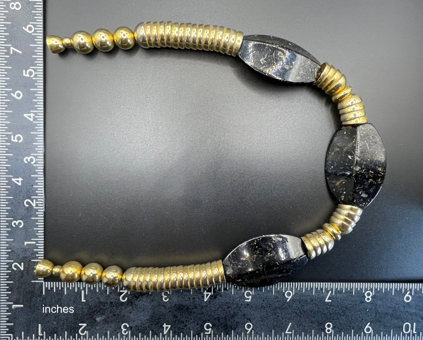 Vintage Jakob Bengel Art Deco 1930s machine age collar necklace with gold tone stacked cup beads and huge black, sparkly galalith beads