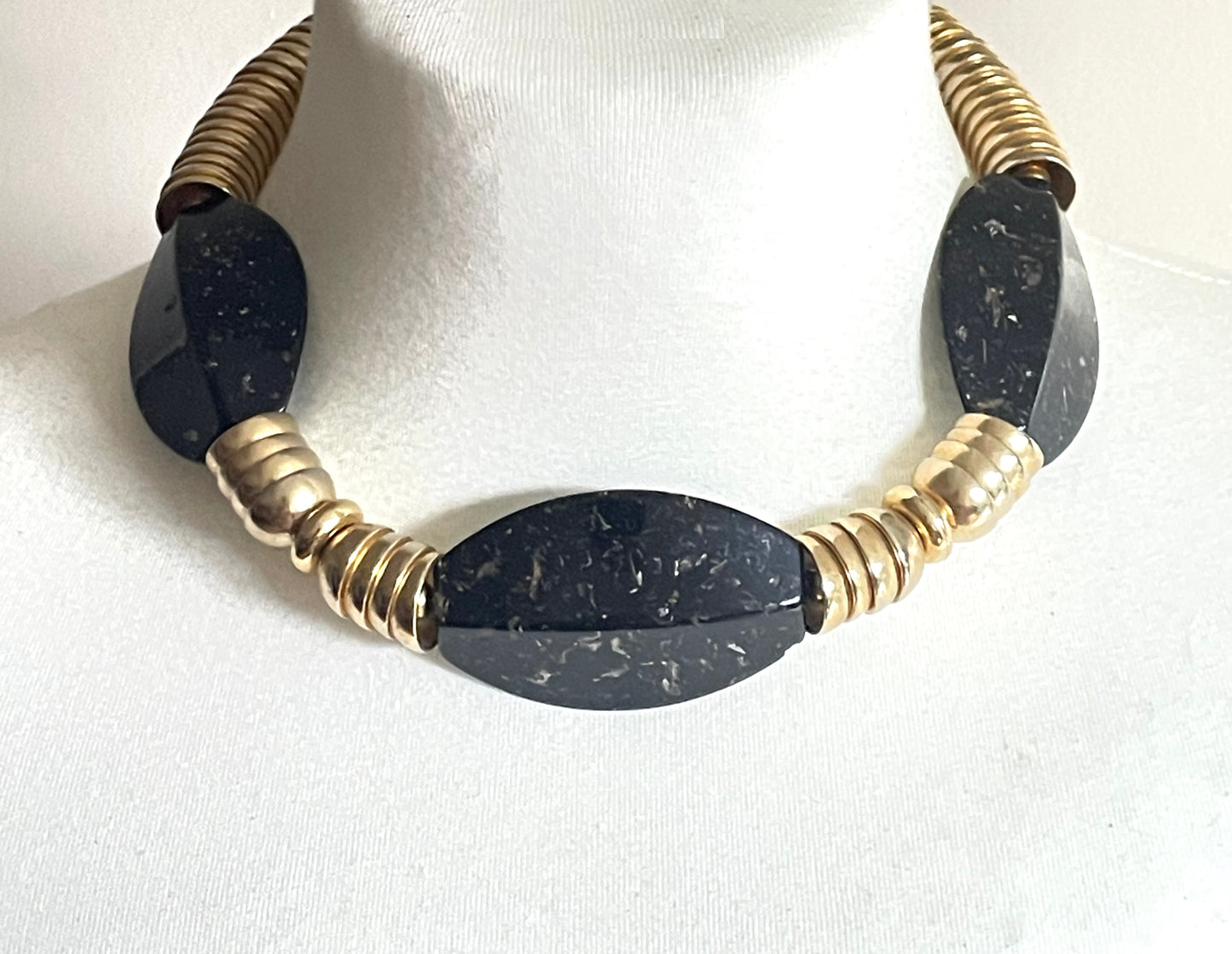 Vintage Jakob Bengel Art Deco 1930s machine age collar necklace with gold tone stacked cup beads and huge black, sparkly galalith beads