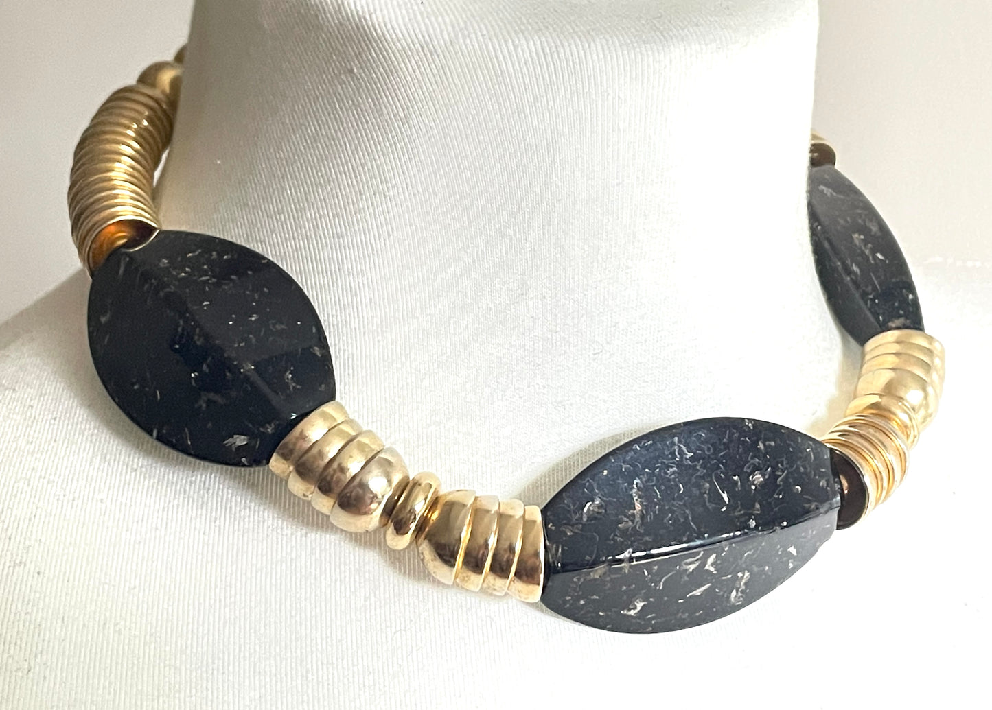 Vintage Jakob Bengel Art Deco 1930s machine age collar necklace with gold tone stacked cup beads and huge black, sparkly galalith beads
