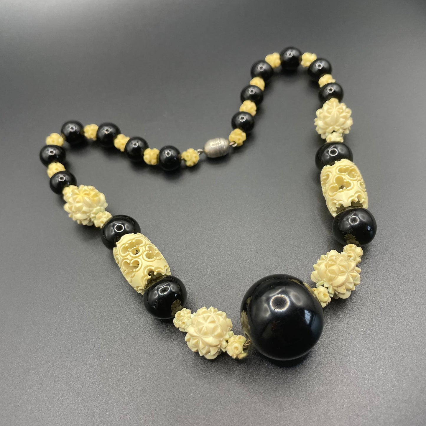 Vintage Louis Rousselet Art Deco carved cream galalith & black glass large bead necklace, beehive clasp 'Made in France', foxtail chain