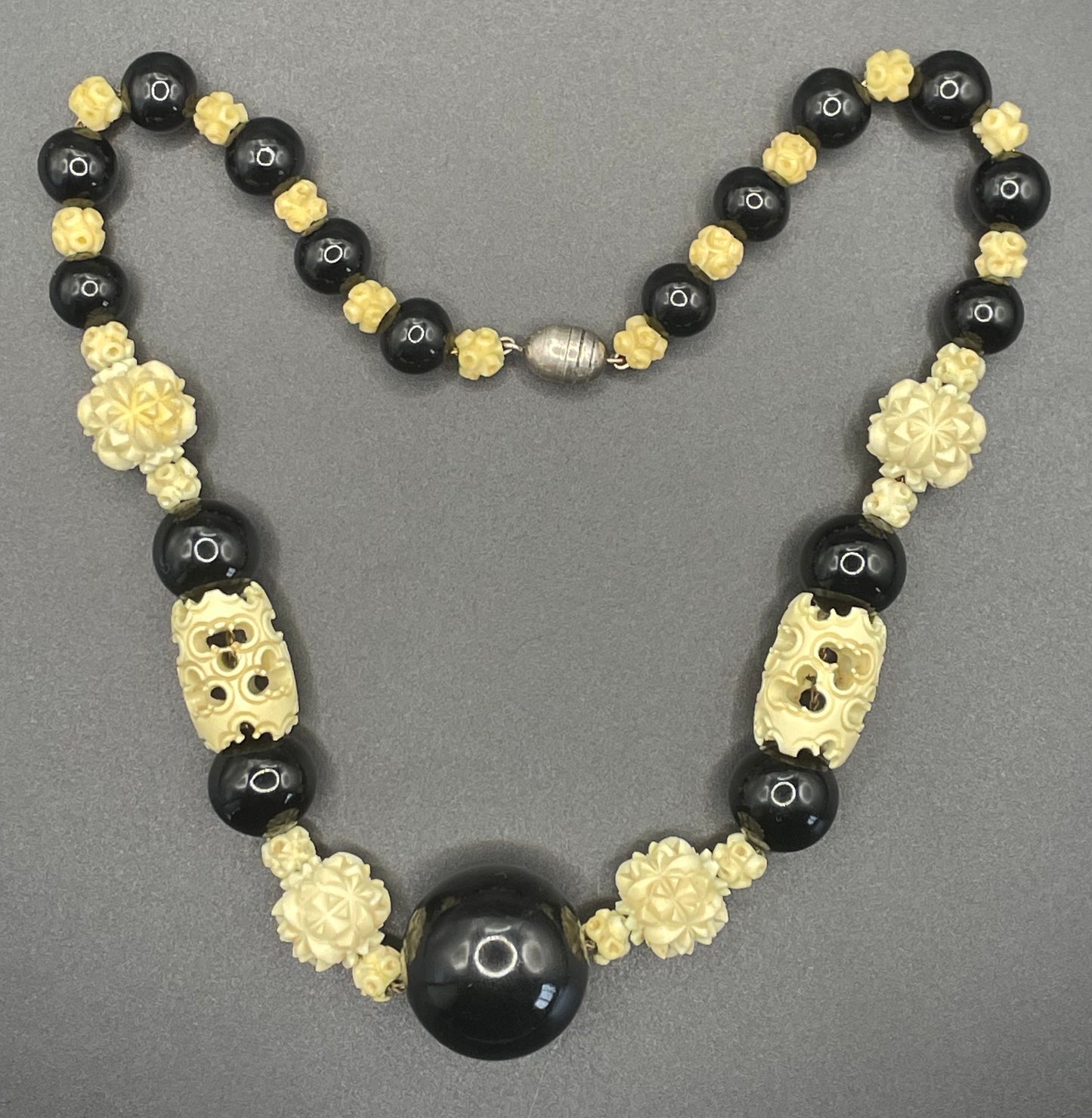 Vintage Louis Rousselet Art Deco carved cream galalith & black glass large bead necklace, beehive clasp 'Made in France', foxtail chain