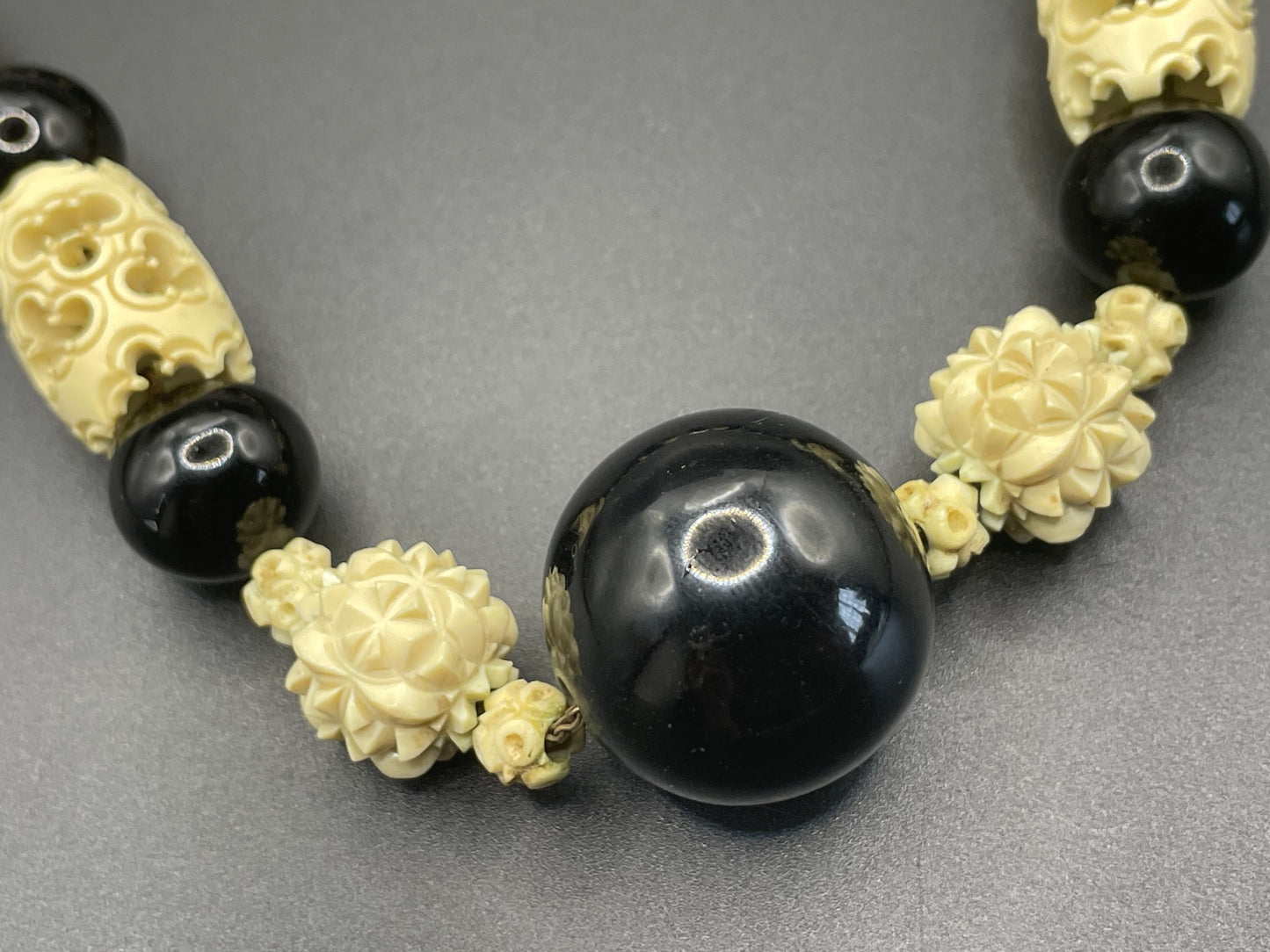 Vintage Louis Rousselet Art Deco carved cream galalith & black glass large bead necklace, beehive clasp 'Made in France', foxtail chain