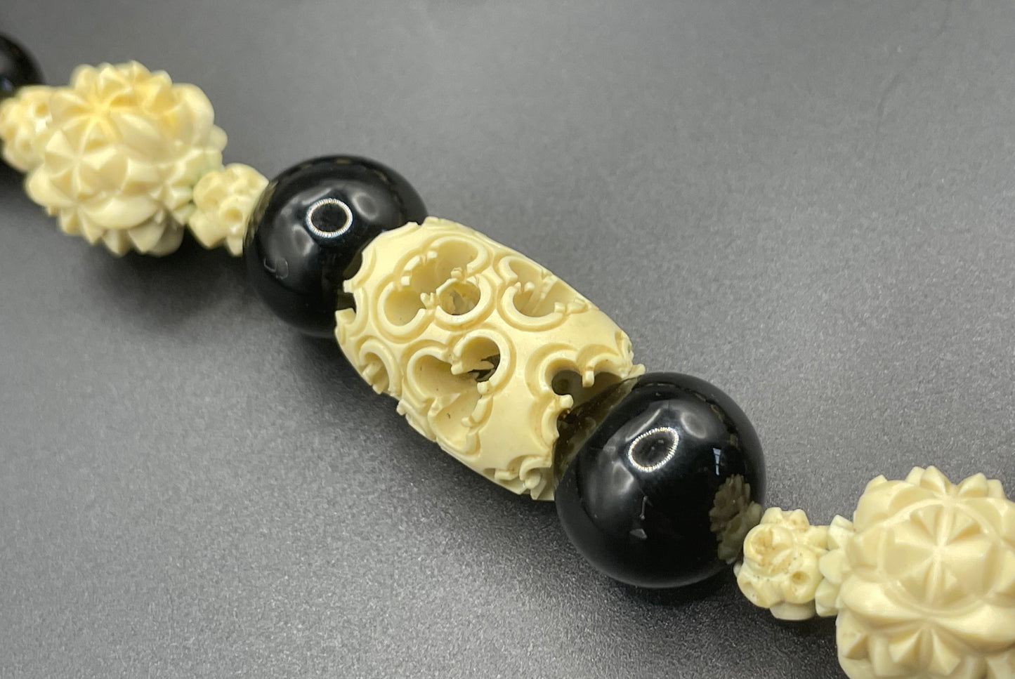 Vintage Louis Rousselet Art Deco carved cream galalith & black glass large bead necklace, beehive clasp 'Made in France', foxtail chain