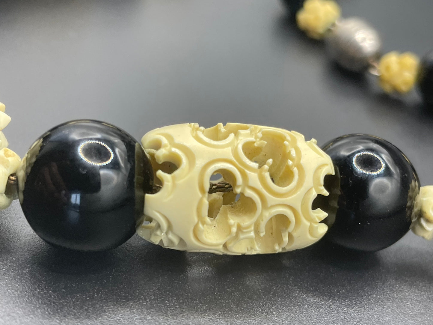 Vintage Louis Rousselet Art Deco carved cream galalith & black glass large bead necklace, beehive clasp 'Made in France', foxtail chain