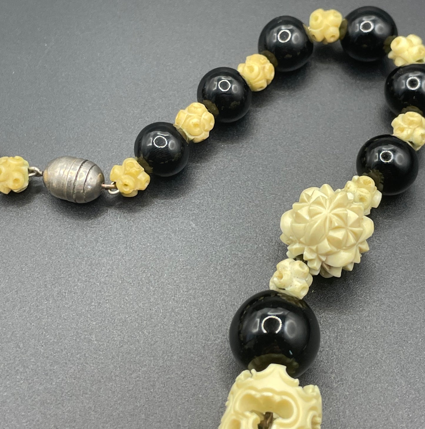 Vintage Louis Rousselet Art Deco carved cream galalith & black glass large bead necklace, beehive clasp 'Made in France', foxtail chain