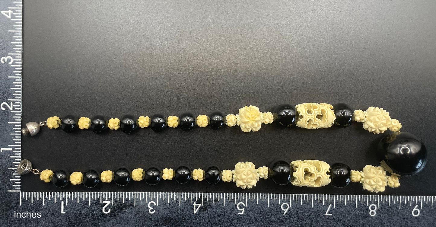 Vintage Louis Rousselet Art Deco carved cream galalith & black glass large bead necklace, beehive clasp 'Made in France', foxtail chain