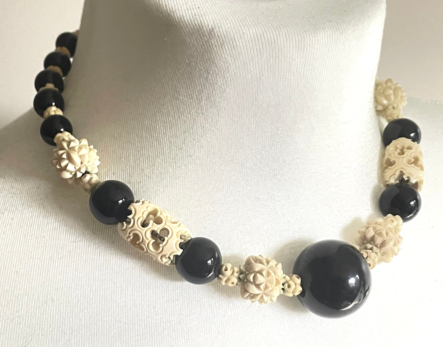 Vintage Louis Rousselet Art Deco carved cream galalith & black glass large bead necklace, beehive clasp 'Made in France', foxtail chain