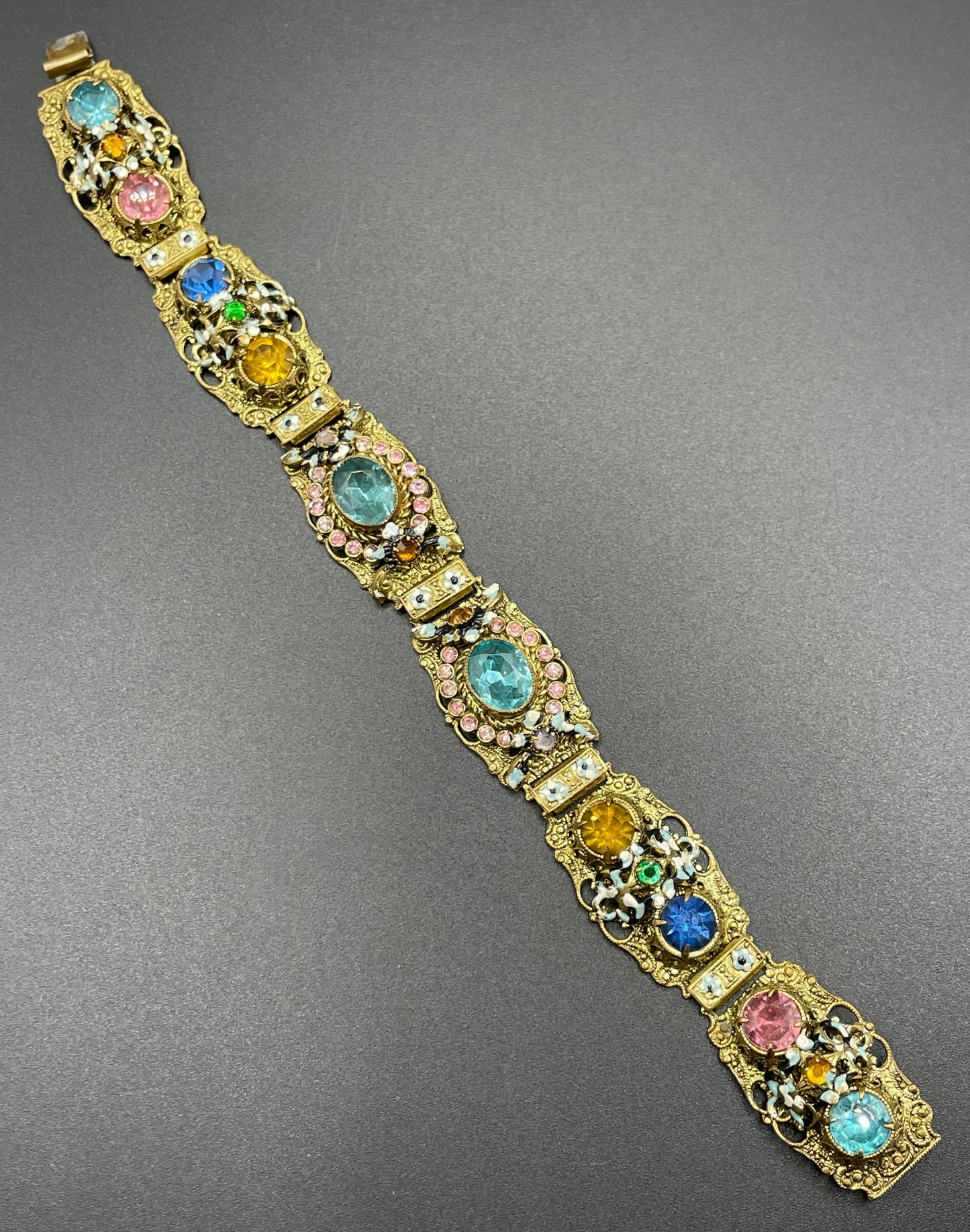 Vintage Art Deco Czech gold tone filigree, multicoloured glass rhinestone and cold painted enamel panel bracelet, possibly Neiger Brothers
