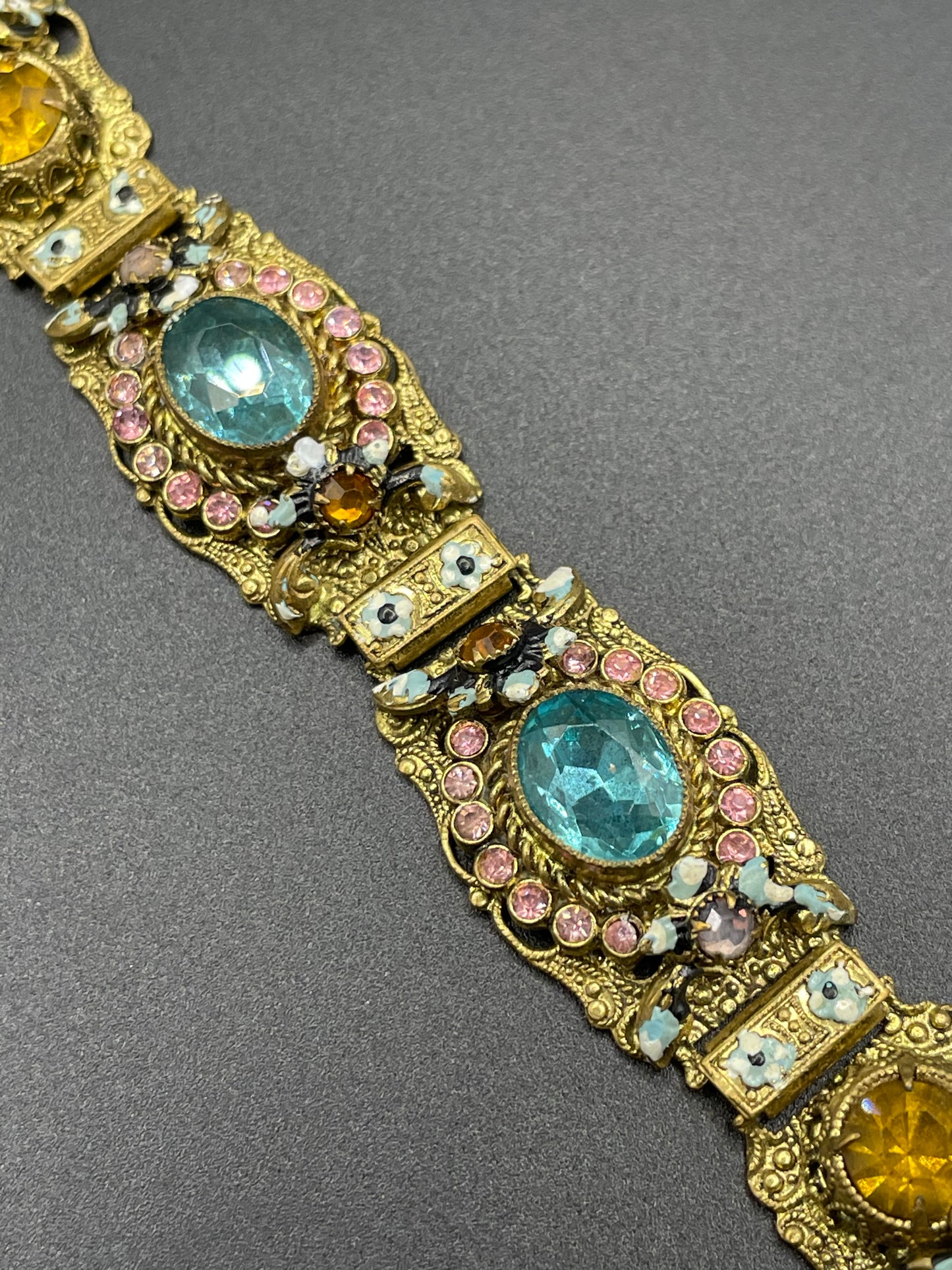 Vintage Art Deco Czech gold tone filigree, multicoloured glass rhinestone and cold painted enamel panel bracelet, possibly Neiger Brothers