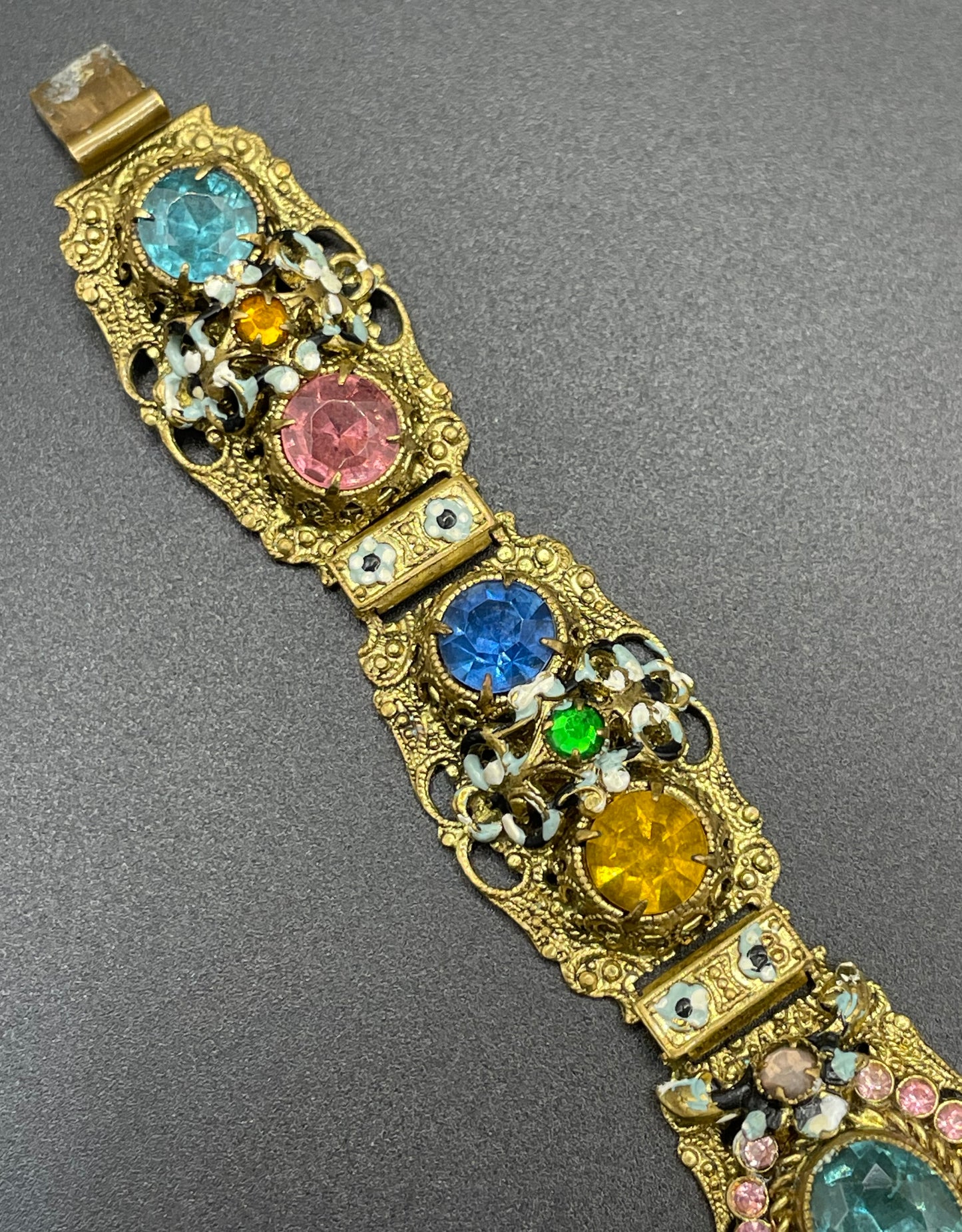 Vintage Art Deco Czech gold tone filigree, multicoloured glass rhinestone and cold painted enamel panel bracelet, possibly Neiger Brothers