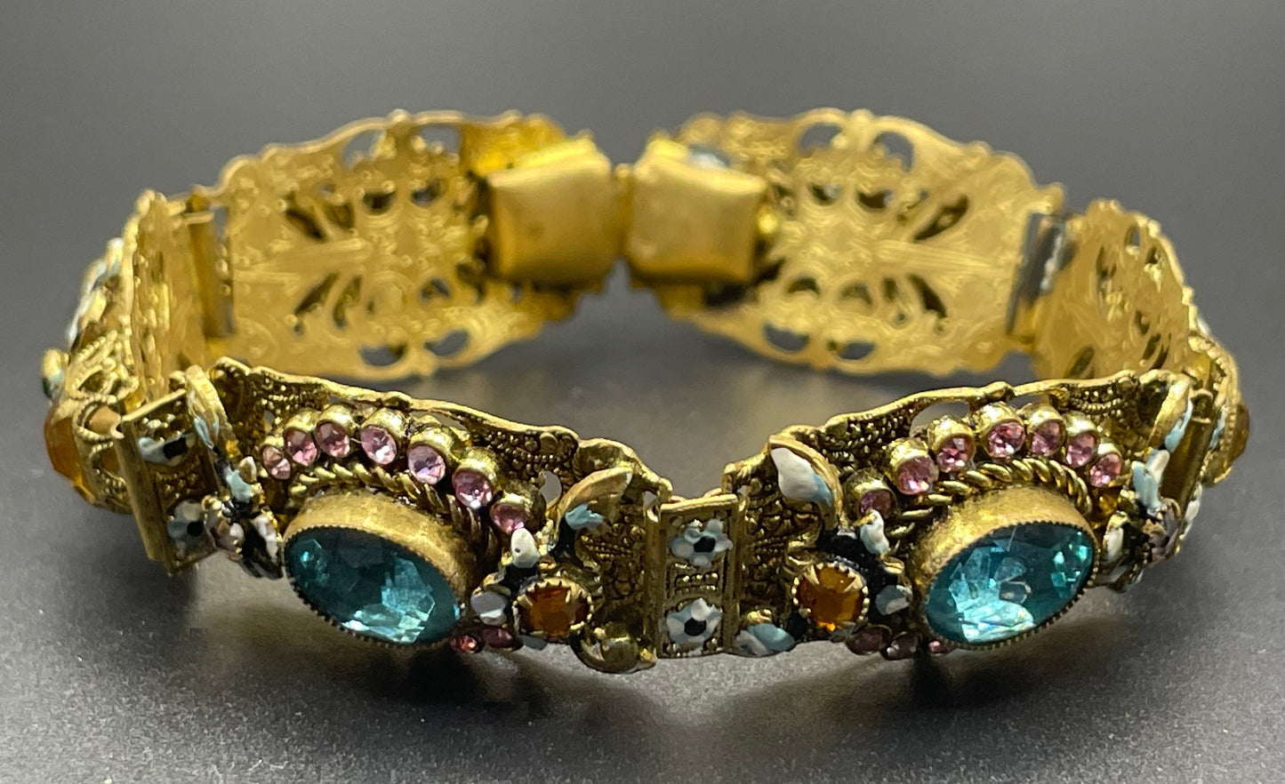 Vintage Art Deco Czech gold tone filigree, multicoloured glass rhinestone and cold painted enamel panel bracelet, possibly Neiger Brothers