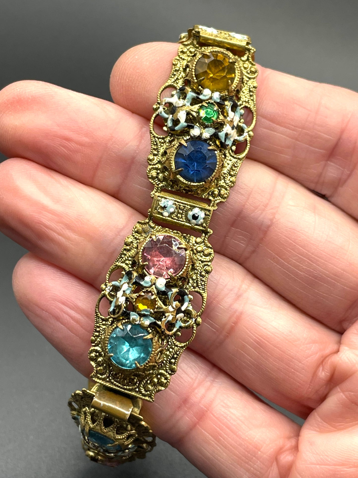 Vintage Art Deco Czech gold tone filigree, multicoloured glass rhinestone and cold painted enamel panel bracelet, possibly Neiger Brothers