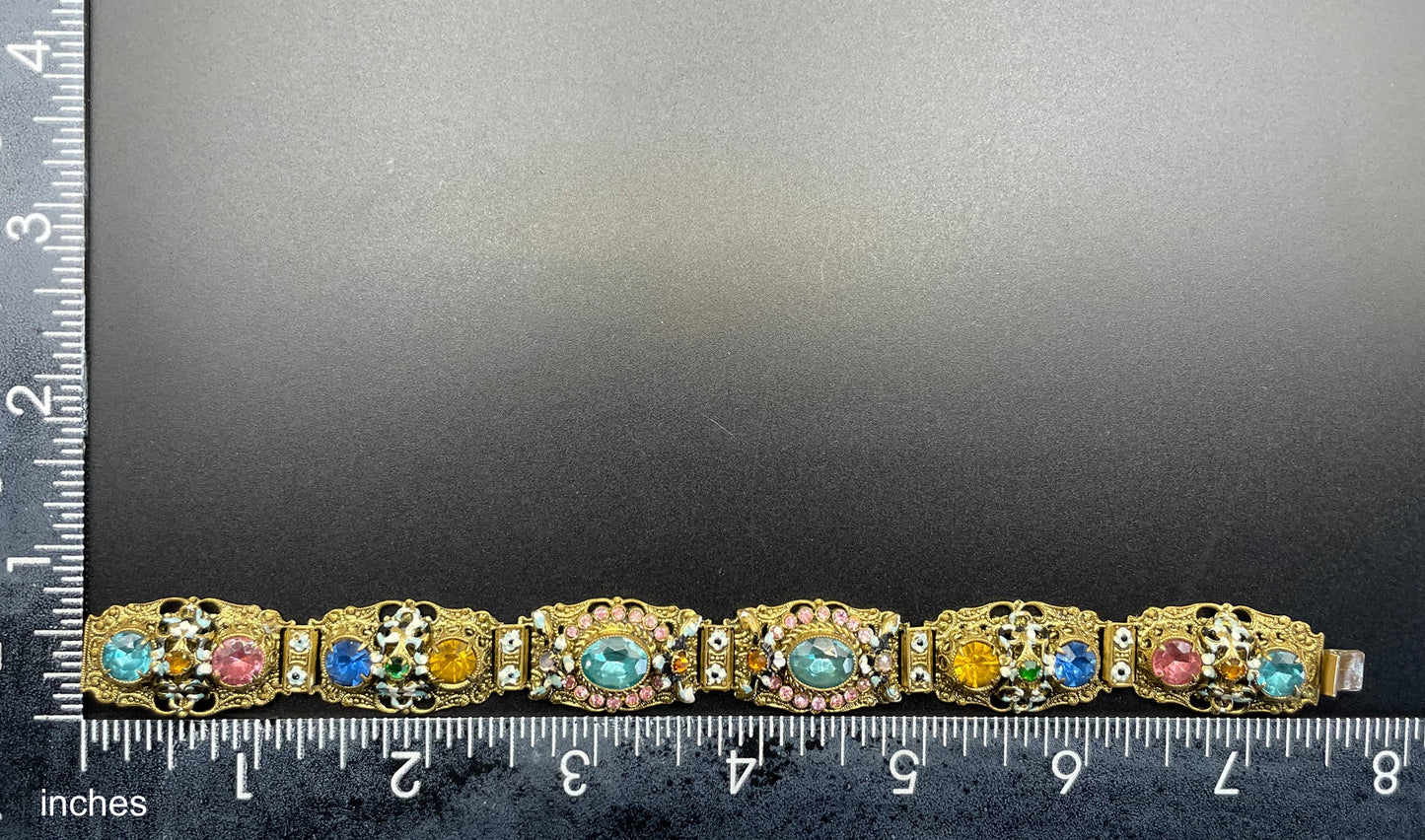 Vintage Art Deco Czech gold tone filigree, multicoloured glass rhinestone and cold painted enamel panel bracelet, possibly Neiger Brothers