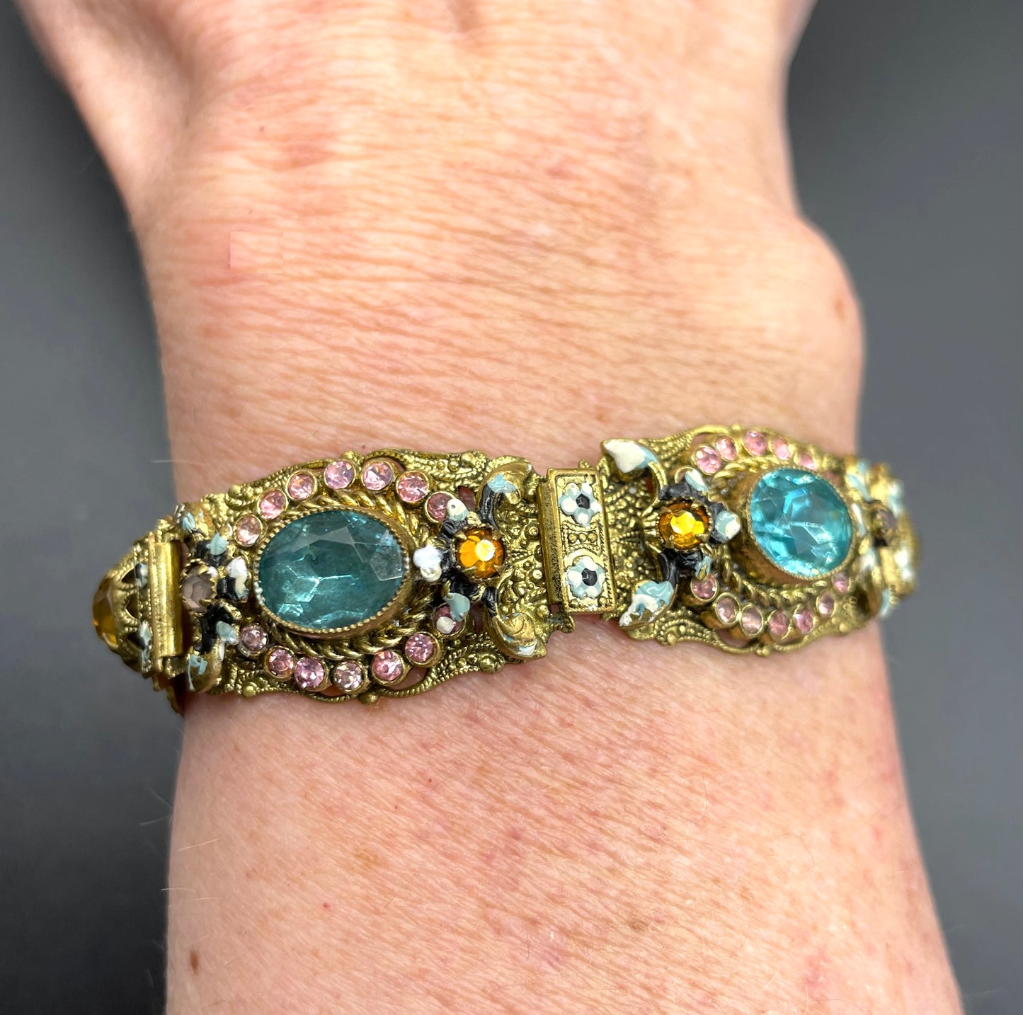 Vintage Art Deco Czech gold tone filigree, multicoloured glass rhinestone and cold painted enamel panel bracelet, possibly Neiger Brothers
