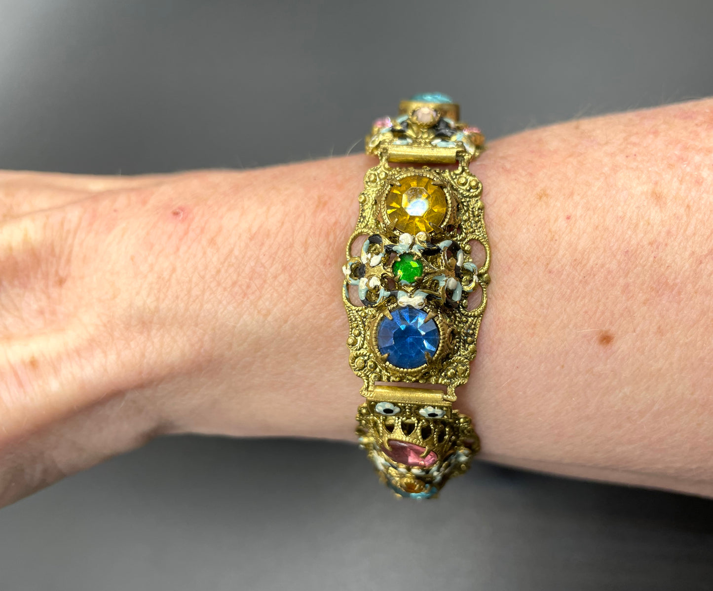 Vintage Art Deco Czech gold tone filigree, multicoloured glass rhinestone and cold painted enamel panel bracelet, possibly Neiger Brothers