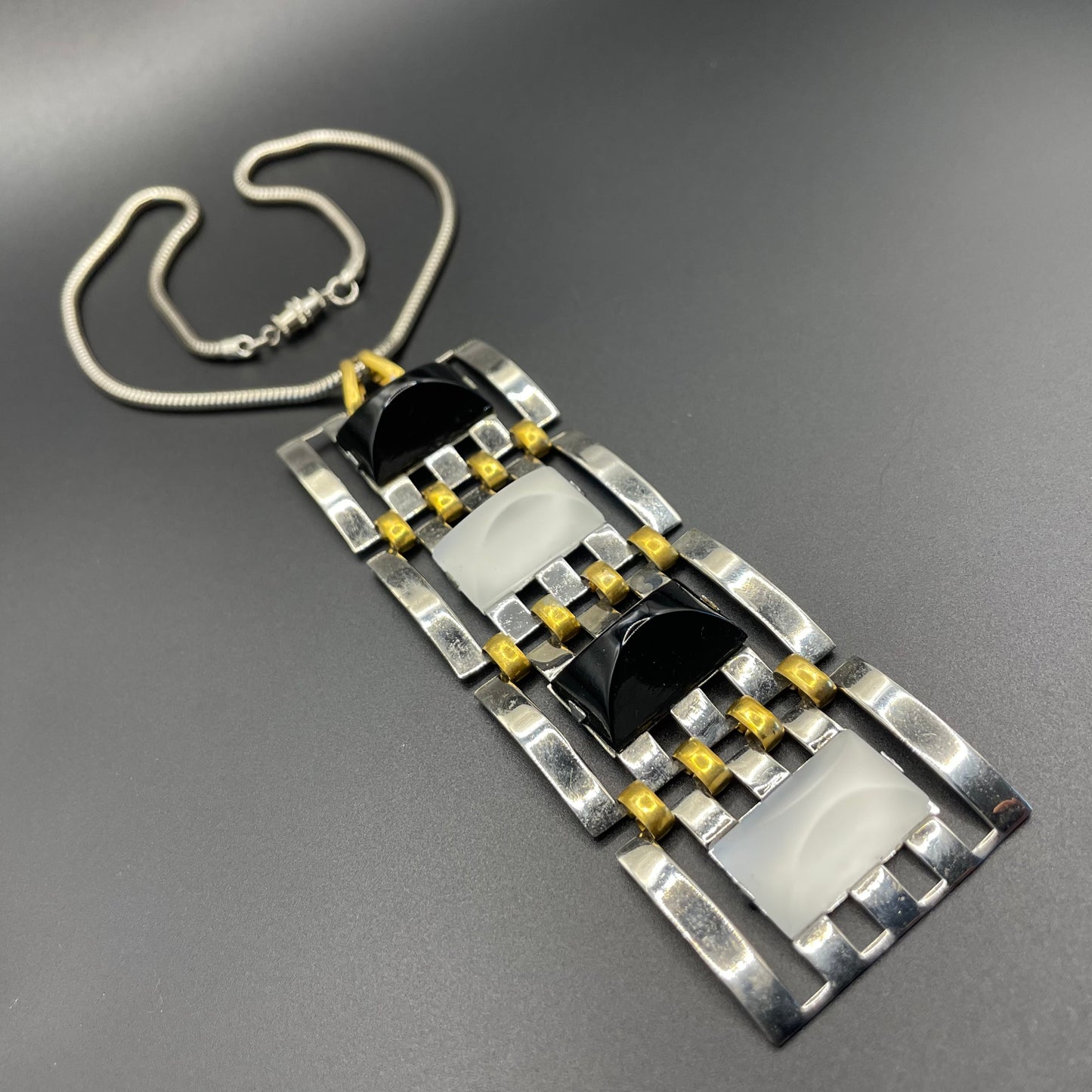 Huge vintage true Art Deco articulated long pendant necklace, silver and gold tone, monochrome black and white moulded glass and snake chain