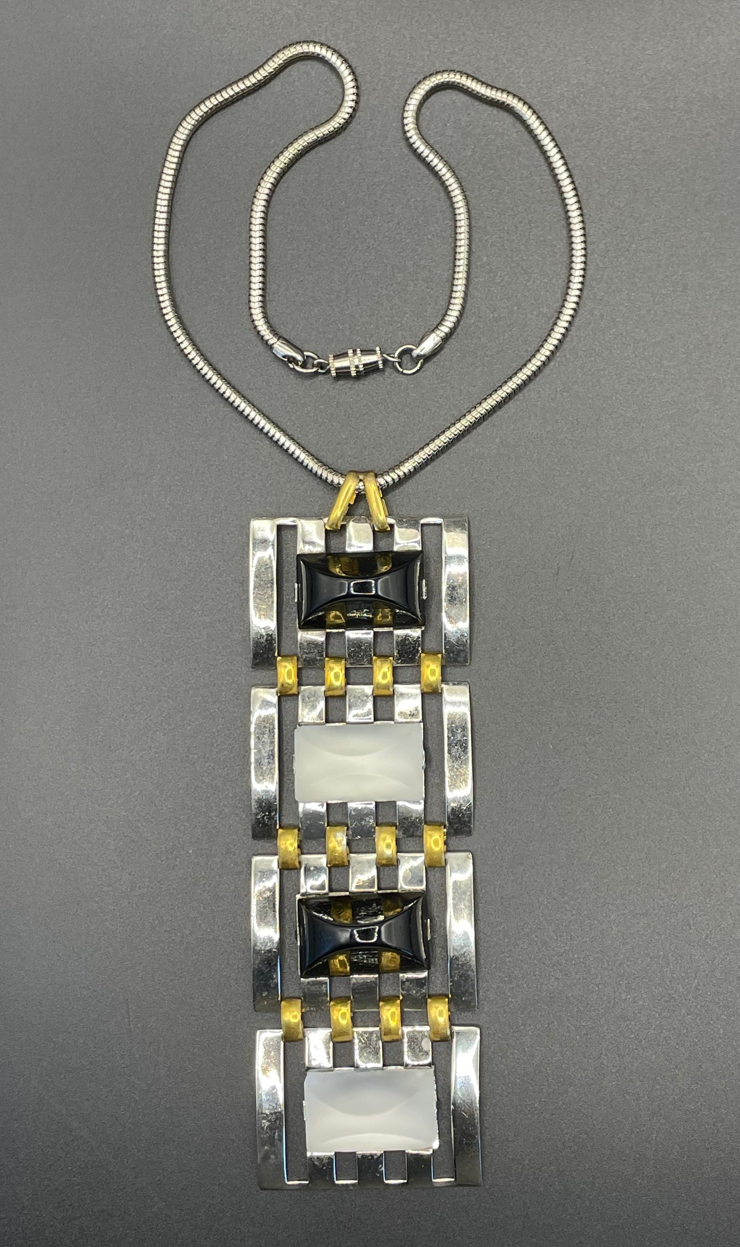 Huge vintage true Art Deco articulated long pendant necklace, silver and gold tone, monochrome black and white moulded glass and snake chain