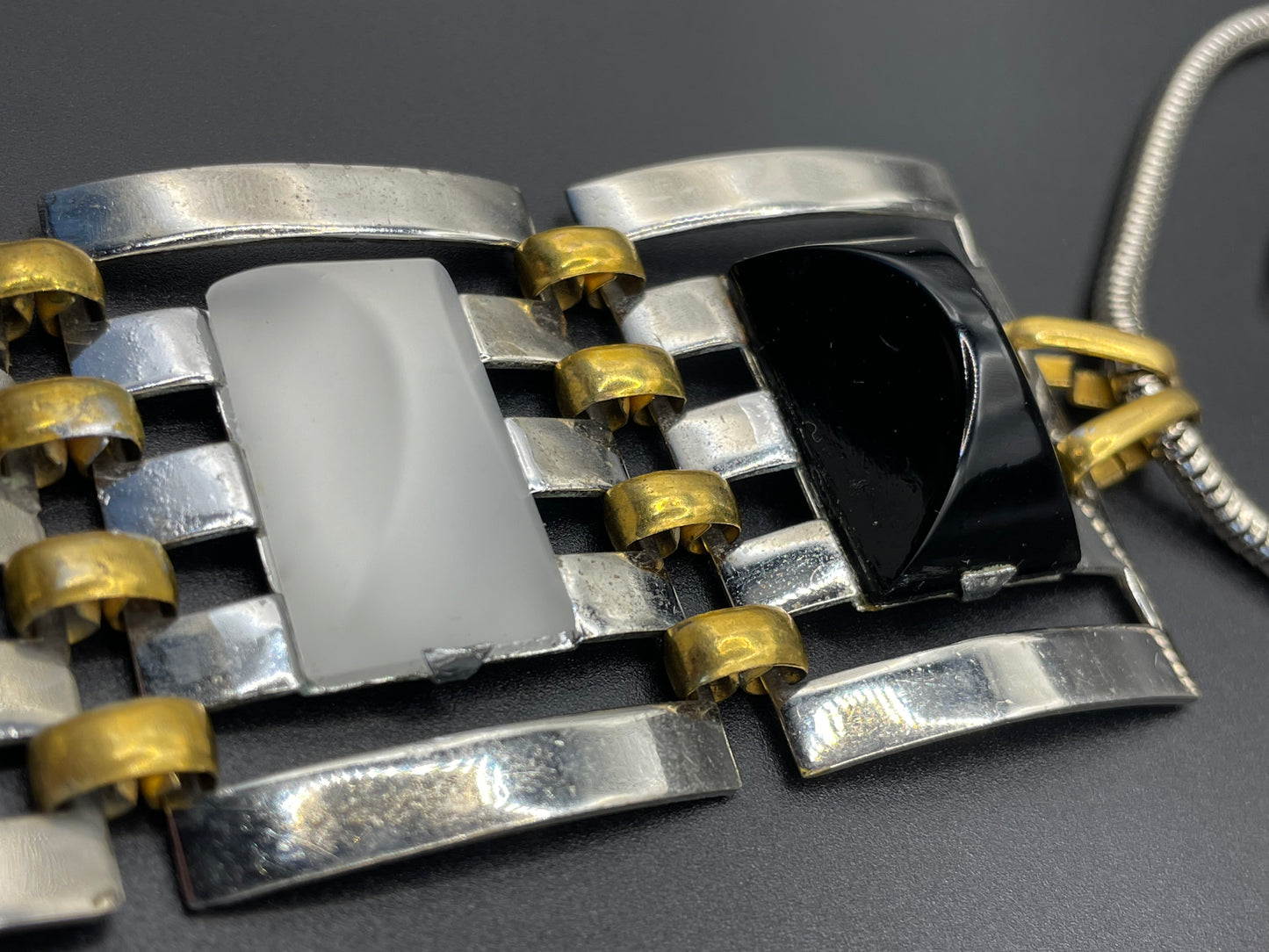 Huge vintage true Art Deco articulated long pendant necklace, silver and gold tone, monochrome black and white moulded glass and snake chain