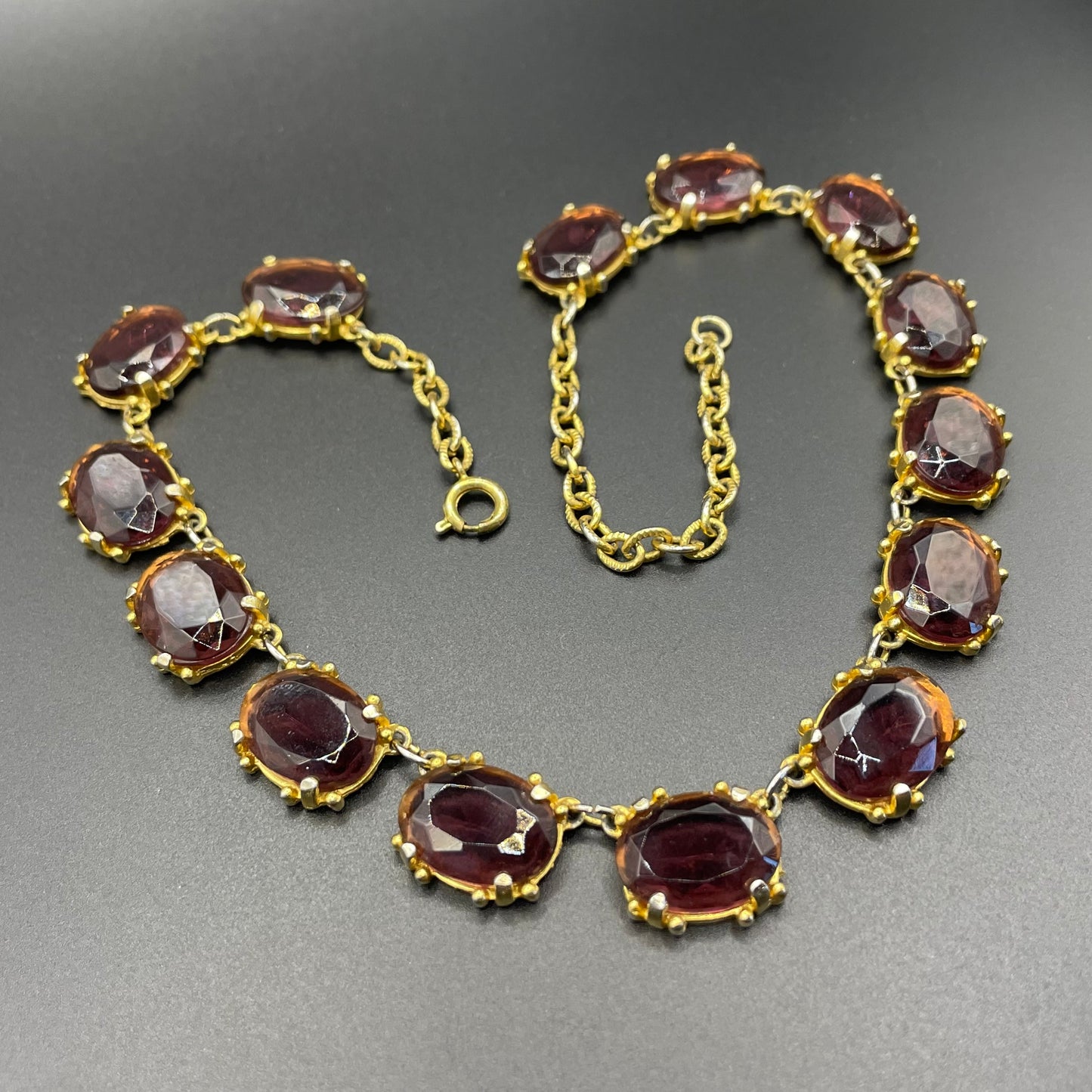 Vintage Sphinx amethyst purple / violet glass riviere necklace, heavy, bezel set, open-backed stones in ornate gold tone setting