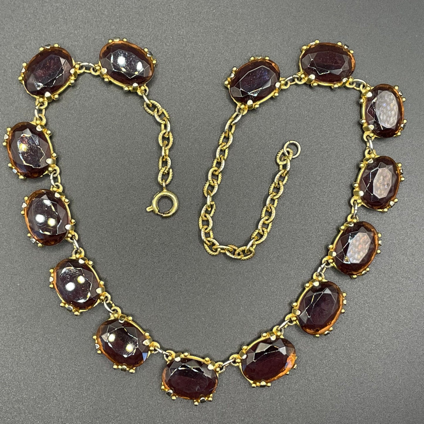 Vintage Sphinx amethyst purple / violet glass riviere necklace, heavy, bezel set, open-backed stones in ornate gold tone setting
