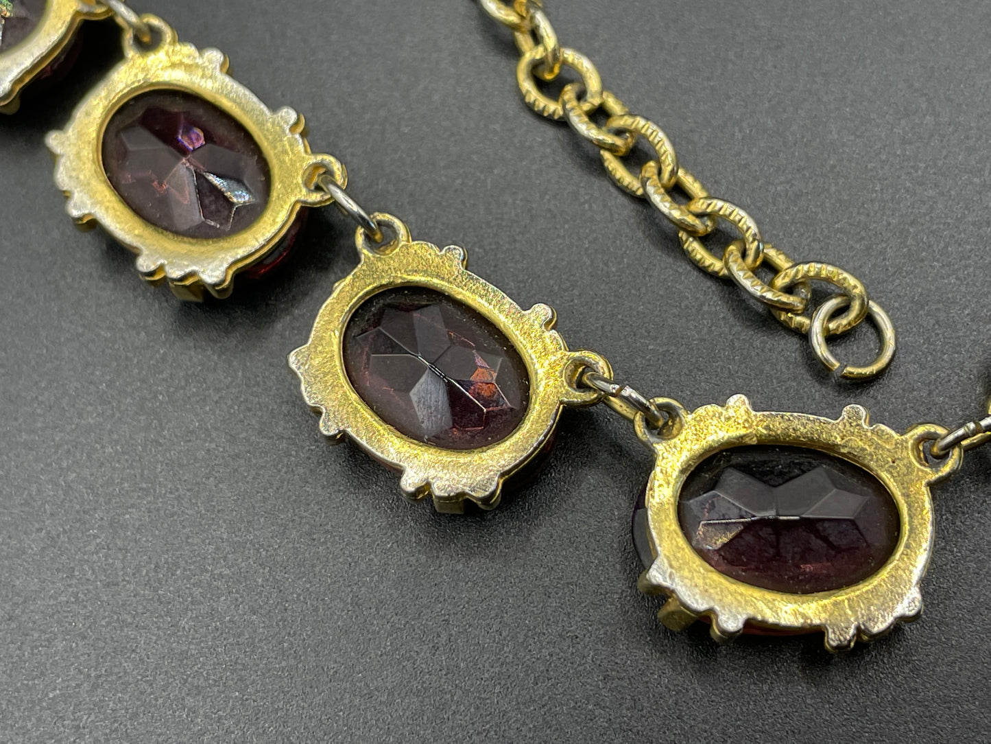 Vintage Sphinx amethyst purple / violet glass riviere necklace, heavy, bezel set, open-backed stones in ornate gold tone setting