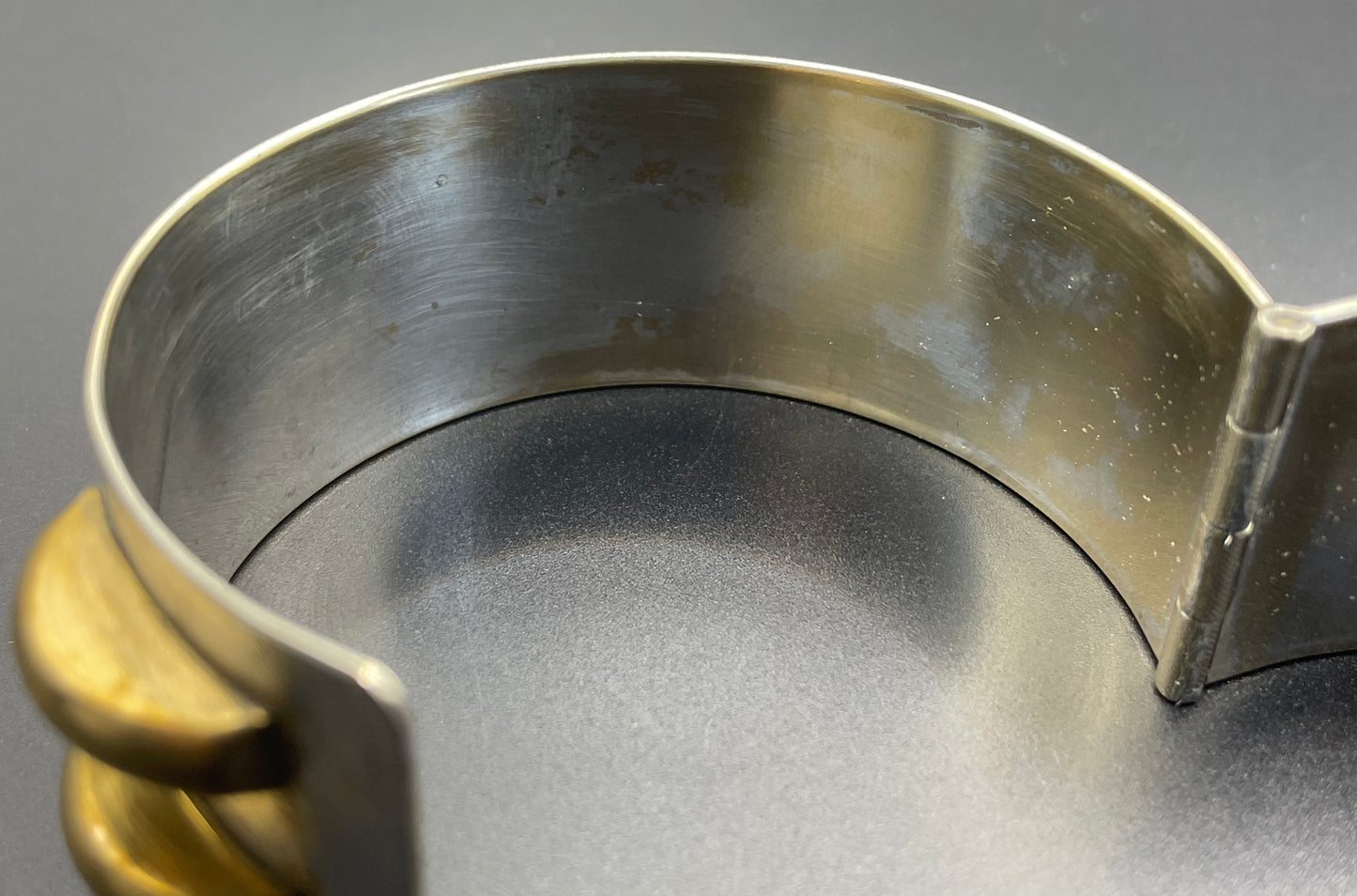 Vintage Art Deco engine turned machine age gold tone gilded on silver tone wide bangle bracelet hinged cuff, abstract Bauhaus design