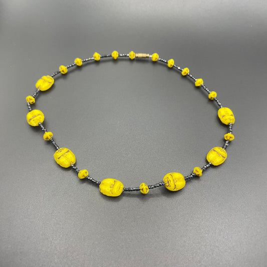 Vintage Art Deco Neiger Egyptian revival scarab glass bead necklace, vibrant bright yellow Czech beads and black spacer beads