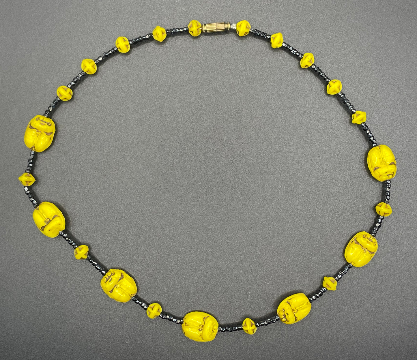 Vintage Art Deco Neiger Egyptian revival scarab glass bead necklace, vibrant bright yellow Czech beads and black spacer beads