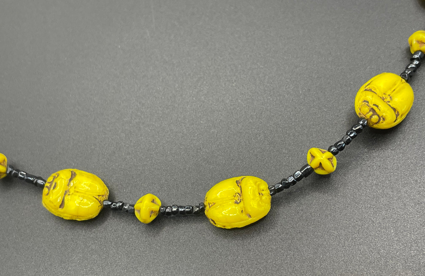 Vintage Art Deco Neiger Egyptian revival scarab glass bead necklace, vibrant bright yellow Czech beads and black spacer beads