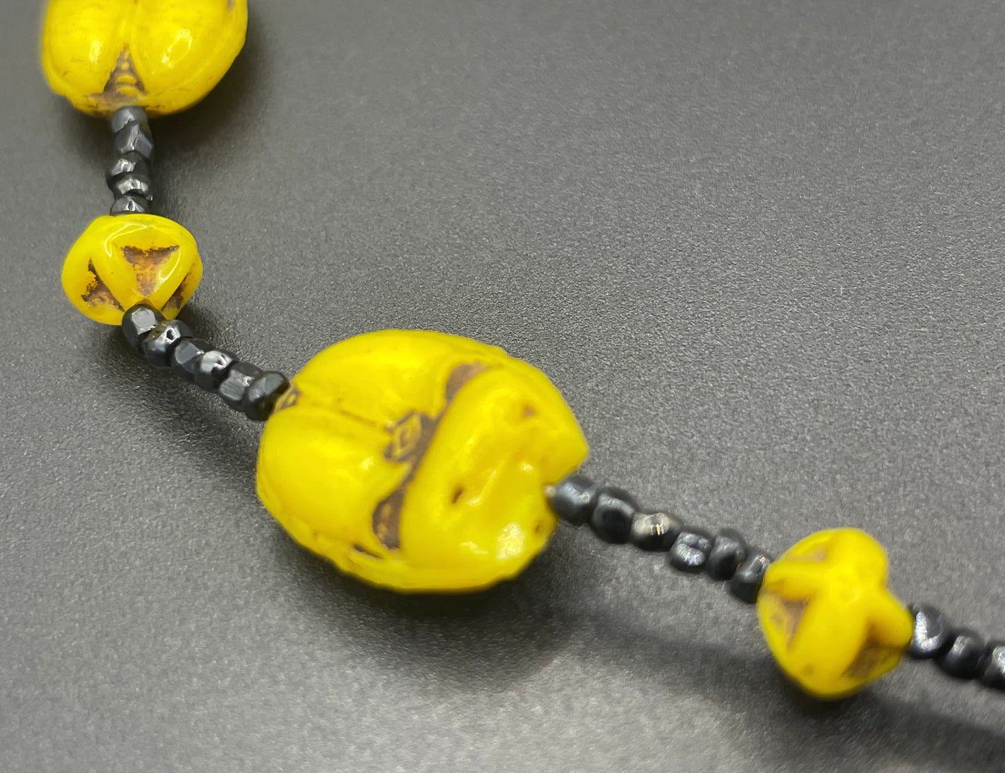 Vintage Art Deco Neiger Egyptian revival scarab glass bead necklace, vibrant bright yellow Czech beads and black spacer beads