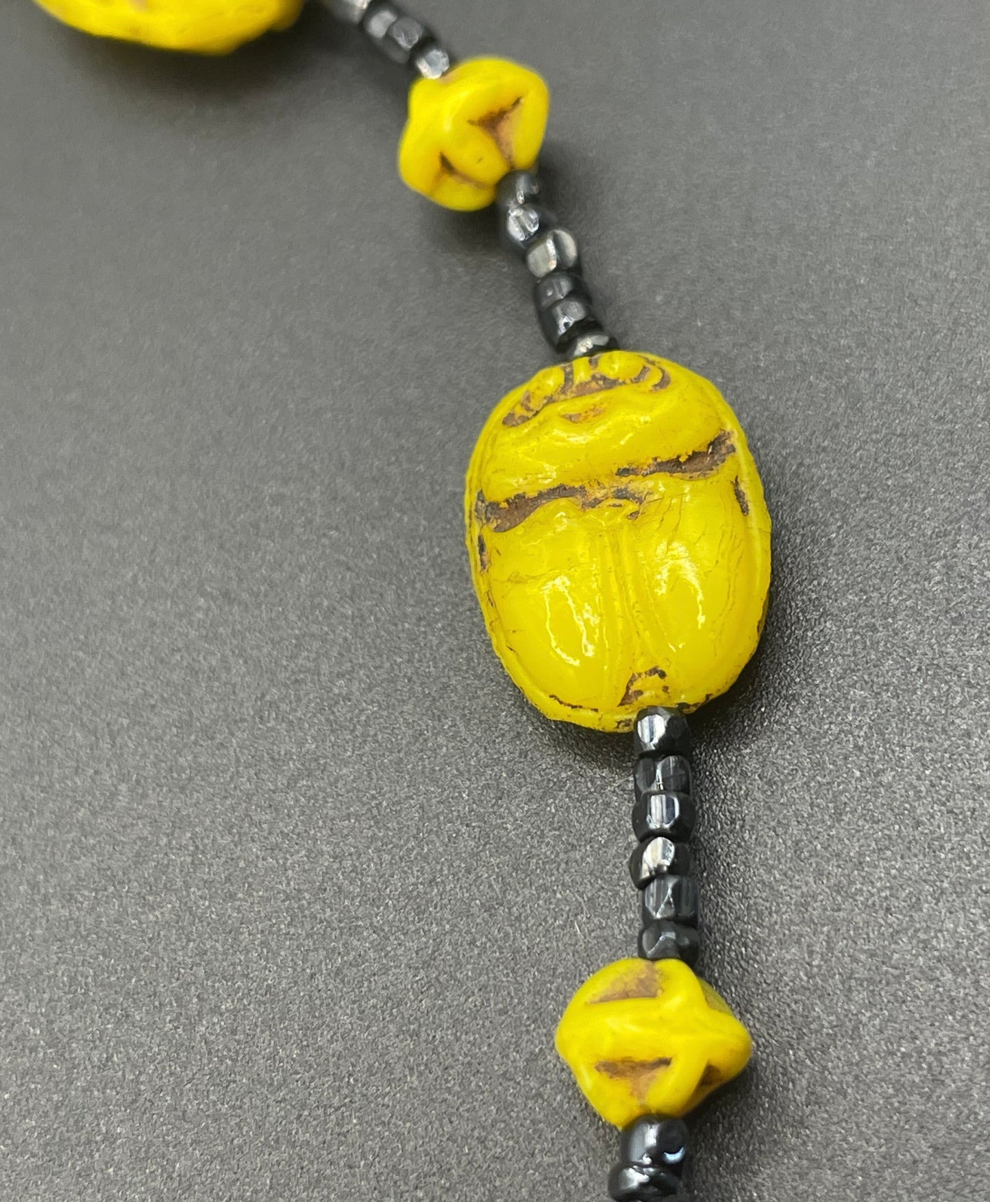 Vintage Art Deco Neiger Egyptian revival scarab glass bead necklace, vibrant bright yellow Czech beads and black spacer beads