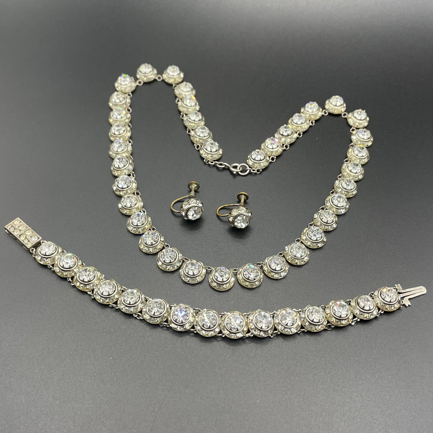 Vintage Art Deco channel set clear rhinestone silver tone machine age necklace, bracelet and screw back earrings set, Schreiber & Hiller ?