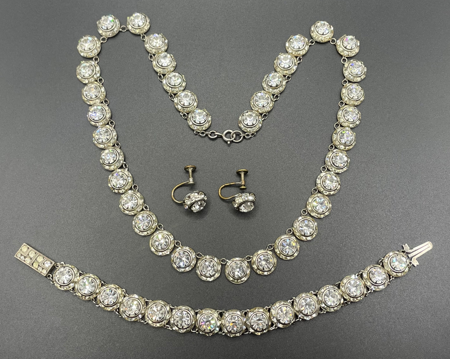 Vintage Art Deco channel set clear rhinestone silver tone machine age necklace, bracelet and screw back earrings set, Schreiber & Hiller ?