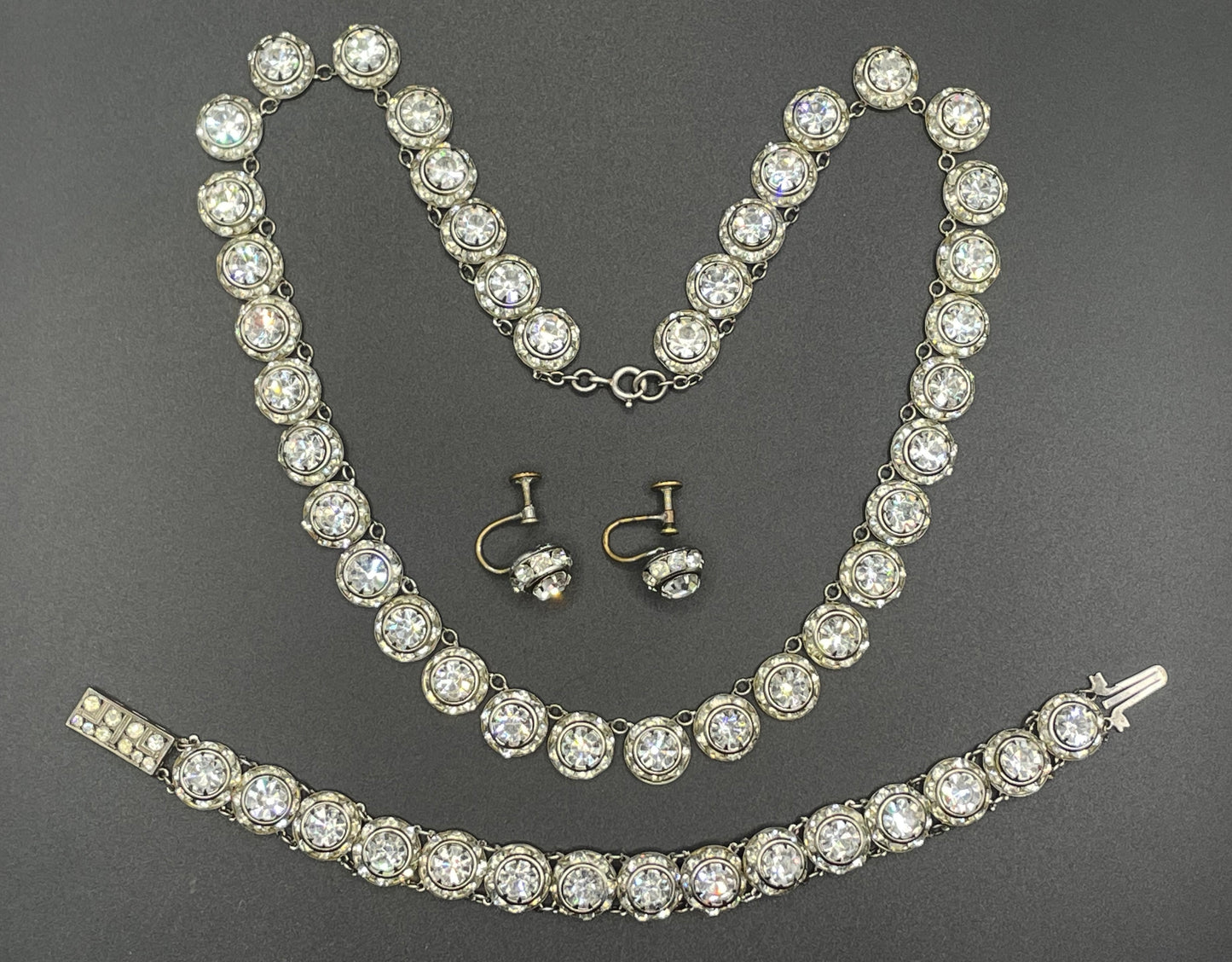 Vintage Art Deco channel set clear rhinestone silver tone machine age necklace, bracelet and screw back earrings set, Schreiber & Hiller ?