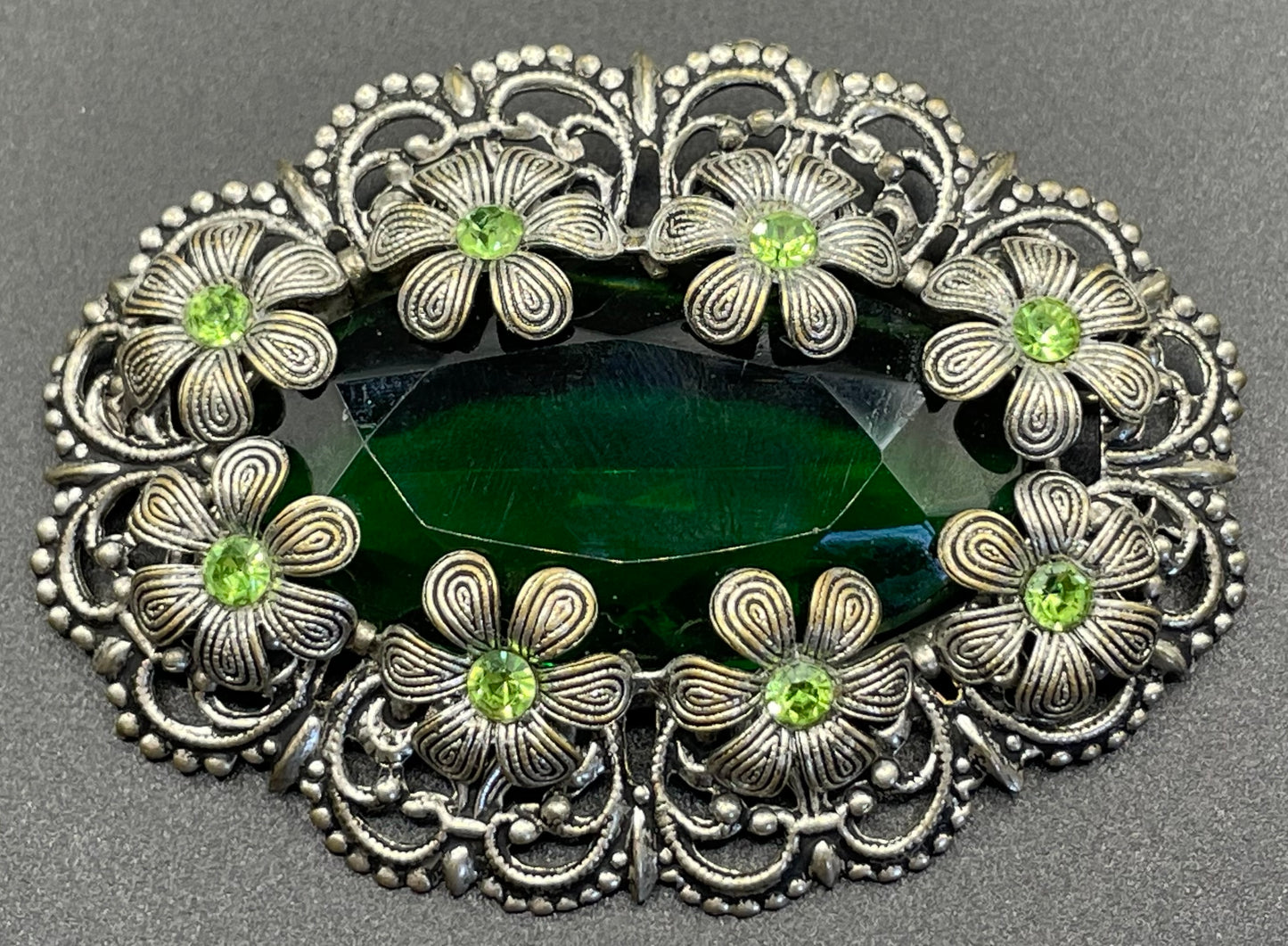 Vintage Art Deco 1930s Czech light & dark green rhinestone brooch with antique silver tone floral filigree - large open backed green crystal