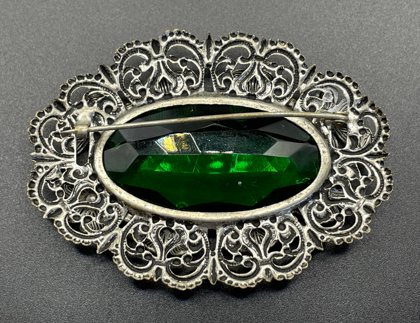 Vintage Art Deco 1930s Czech light & dark green rhinestone brooch with antique silver tone floral filigree - large open backed green crystal