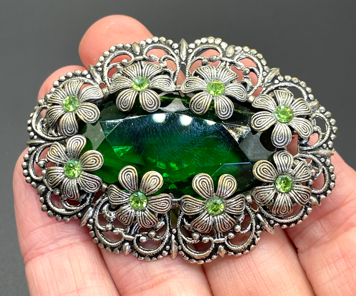 Vintage Art Deco 1930s Czech light & dark green rhinestone brooch with antique silver tone floral filigree - large open backed green crystal