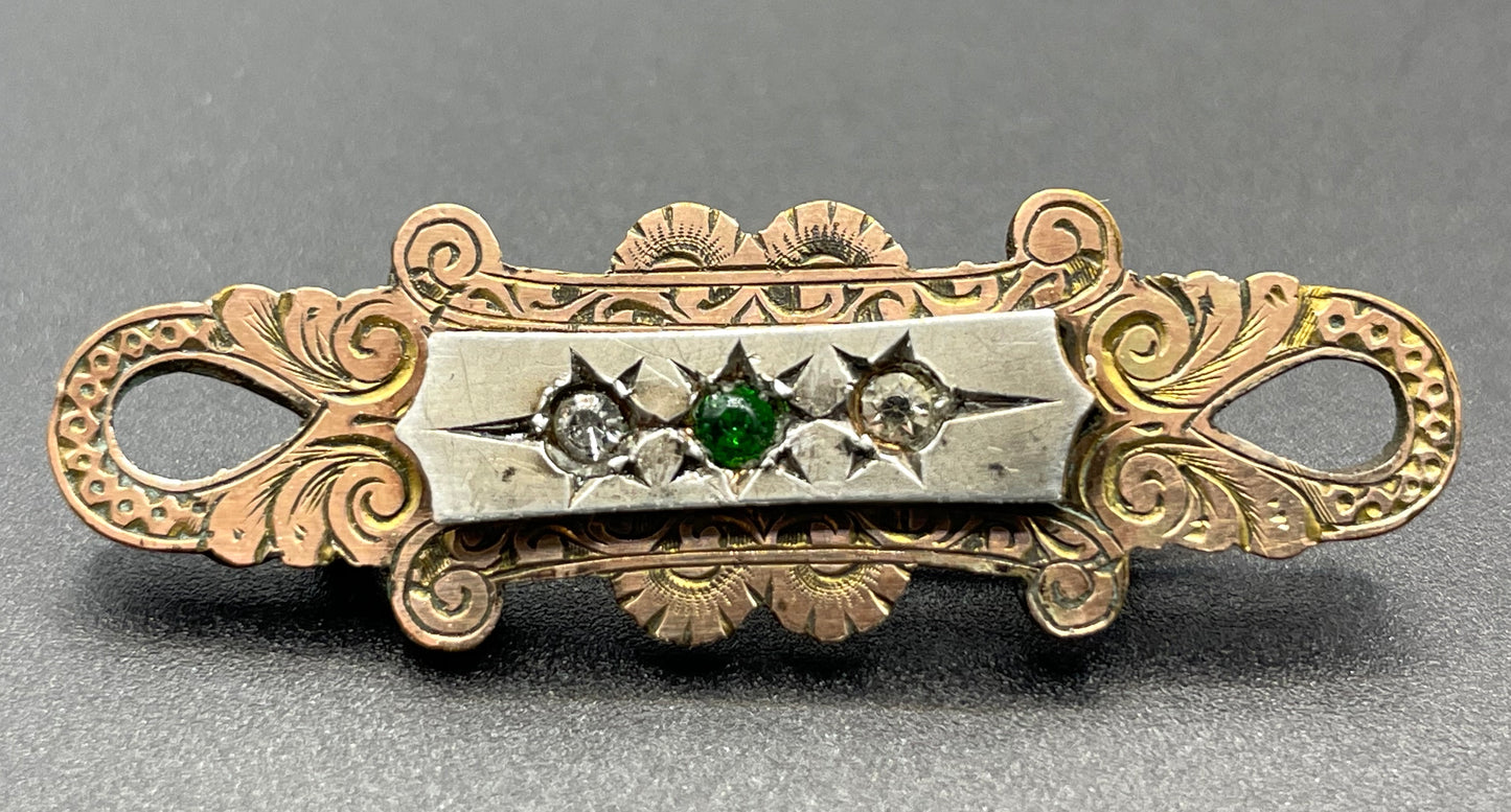 Adorable small antique Victorian gold tone (probably rolled gold) and silver fronted brooch, with clear and green (untested) stones, stamped