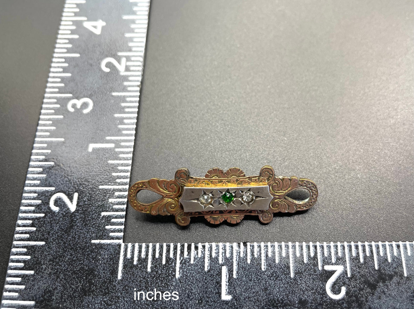 Adorable small antique Victorian gold tone (probably rolled gold) and silver fronted brooch, with clear and green (untested) stones, stamped