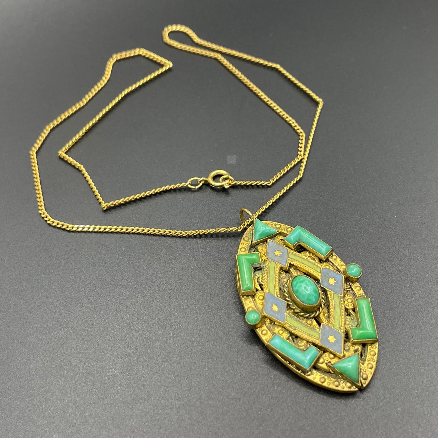 Vintage Neiger pendant with moulded green glass geometric shapes, enamel and 'Peking' style glass cabochons in gold tone filigree