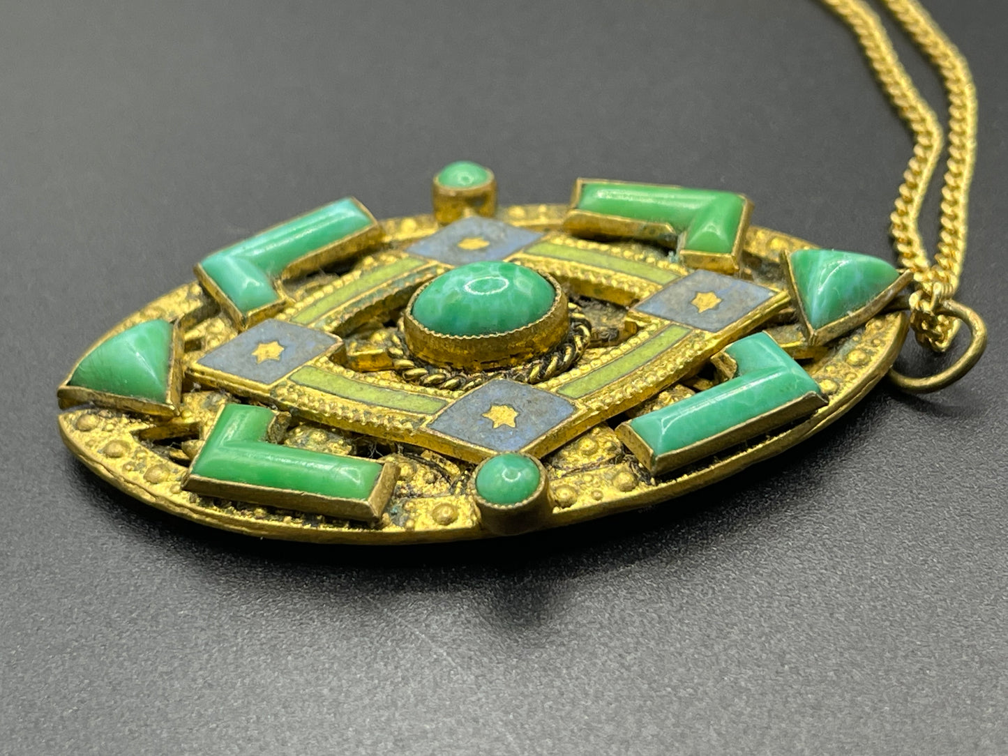 Vintage Neiger pendant with moulded green glass geometric shapes, enamel and 'Peking' style glass cabochons in gold tone filigree