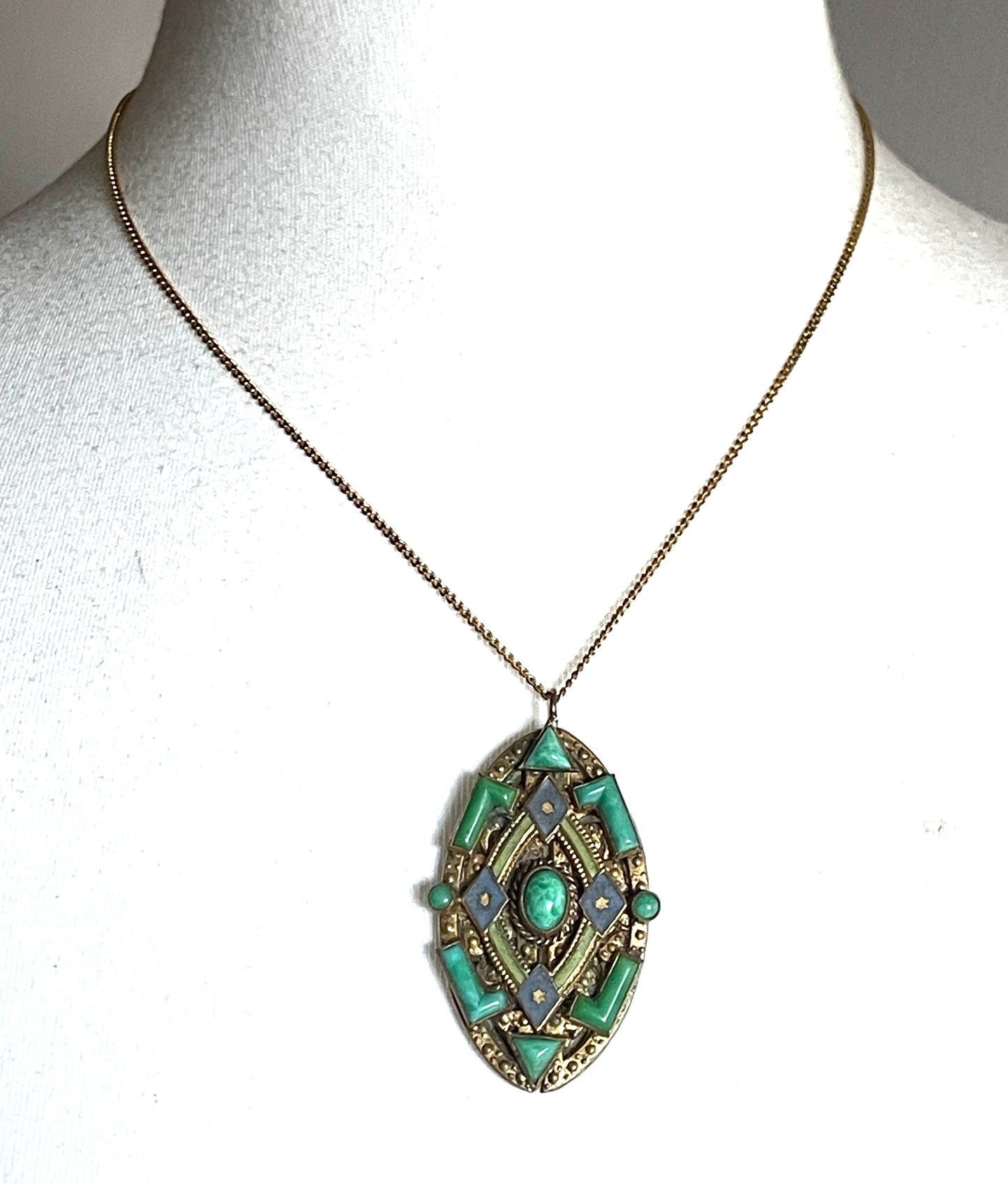 Vintage Neiger pendant with moulded green glass geometric shapes, enamel and 'Peking' style glass cabochons in gold tone filigree