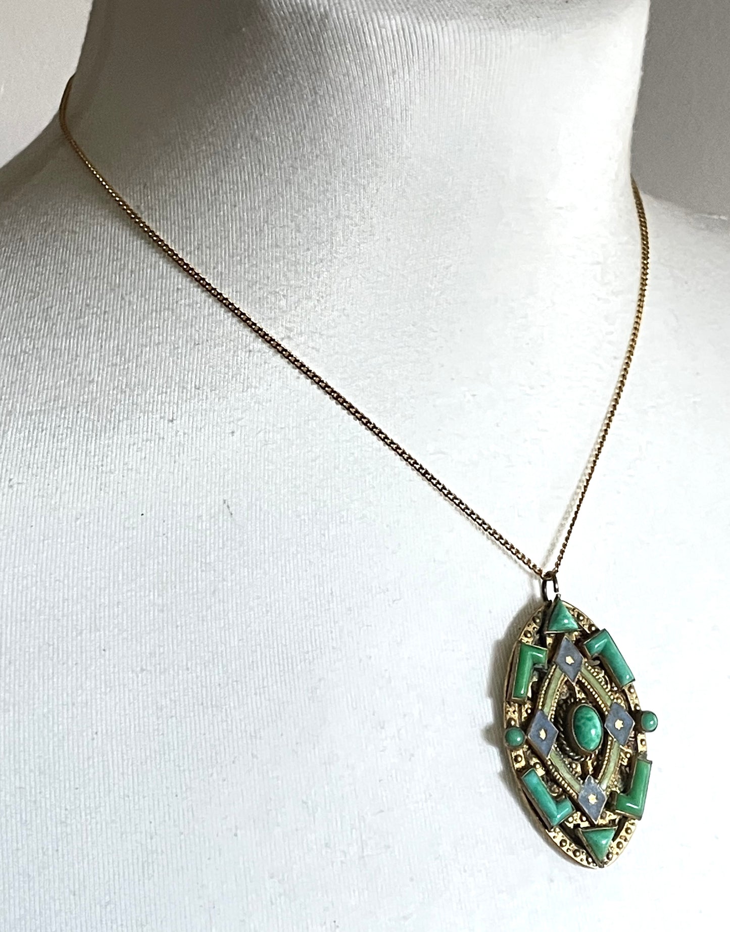 Vintage Neiger pendant with moulded green glass geometric shapes, enamel and 'Peking' style glass cabochons in gold tone filigree
