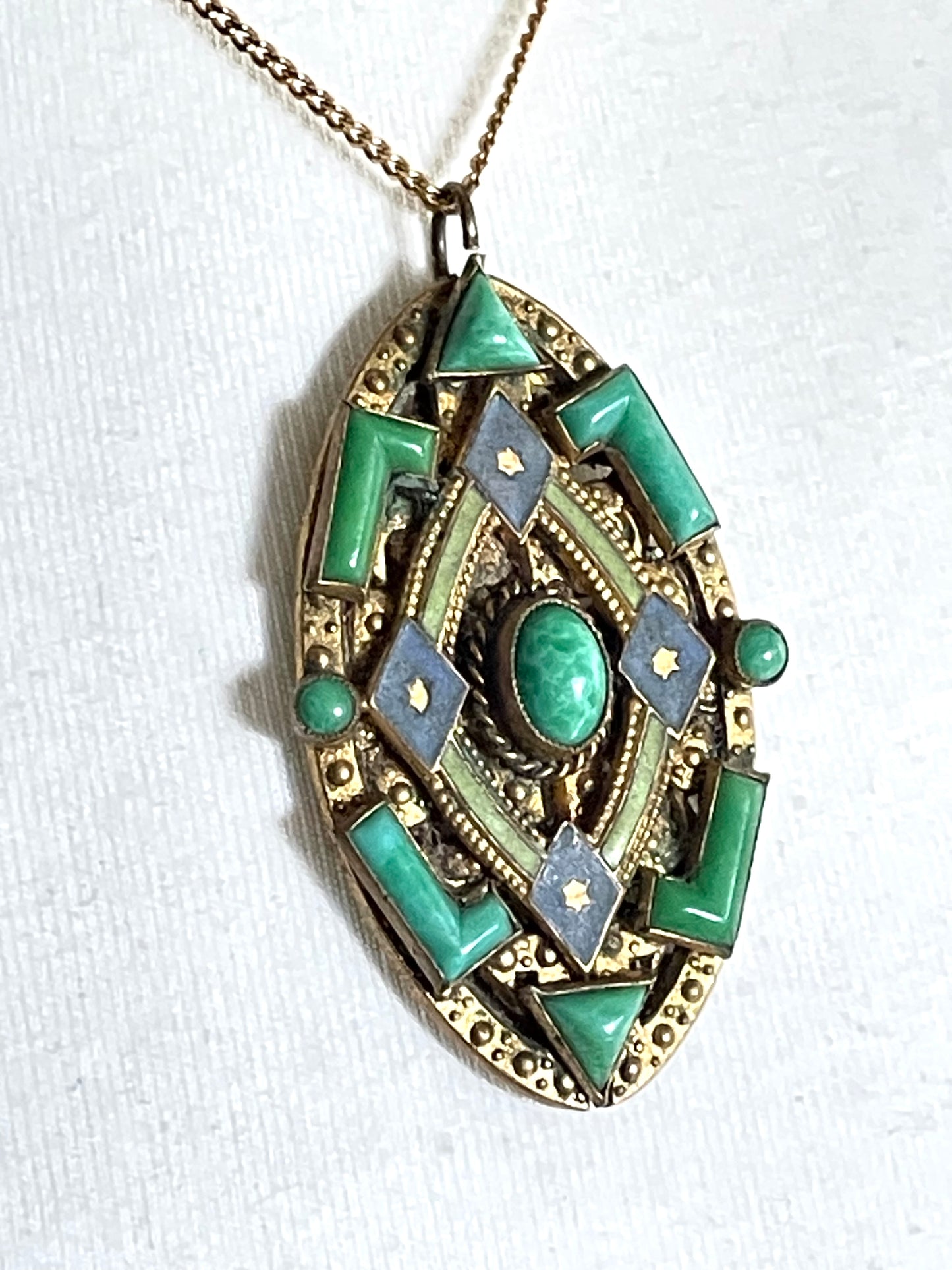 Vintage Neiger pendant with moulded green glass geometric shapes, enamel and 'Peking' style glass cabochons in gold tone filigree