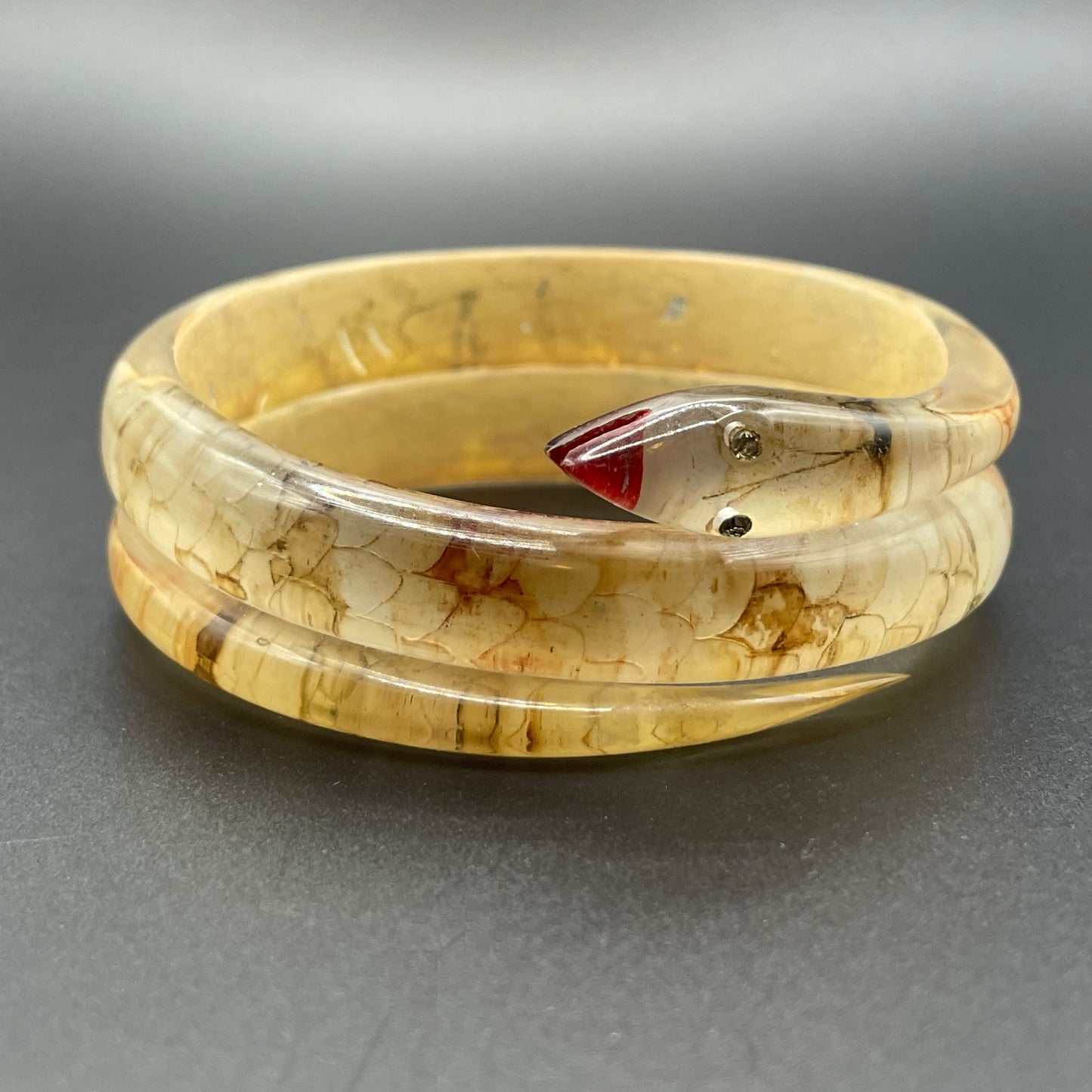 Vintage Art Deco 1920s to 1930s reverse painted, clear celluloid spiral snake bangle bracelet, clear rhinestone eyes