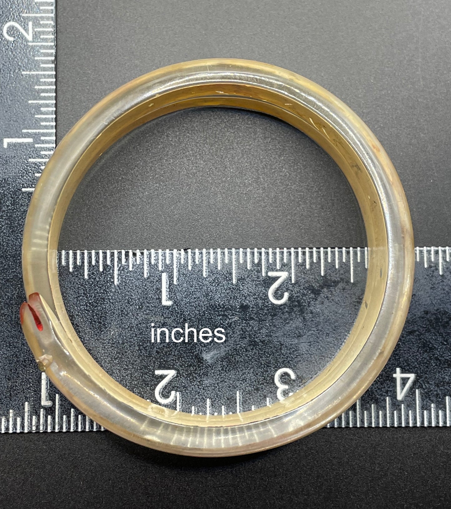 Vintage Art Deco 1920s to 1930s reverse painted, clear celluloid spiral snake bangle bracelet, clear rhinestone eyes