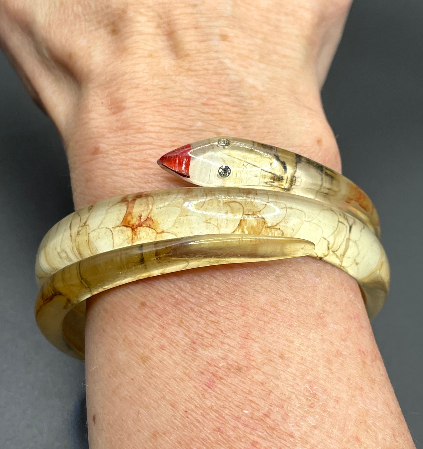 Vintage Art Deco 1920s to 1930s reverse painted, clear celluloid spiral snake bangle bracelet, clear rhinestone eyes