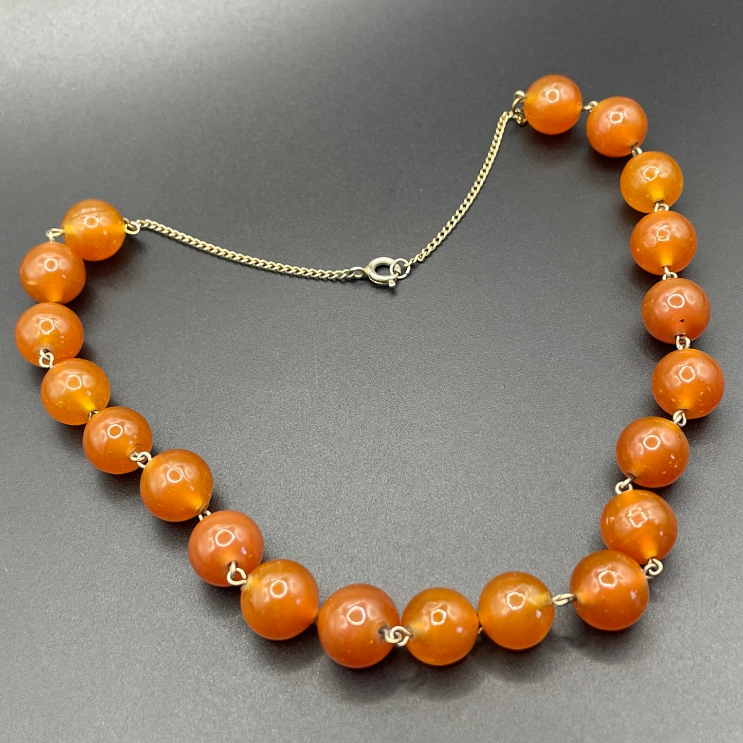 Vintage Art Deco uranium glass Carnelian coloured beaded necklace, lovely orange beads that glow yellow under UV light